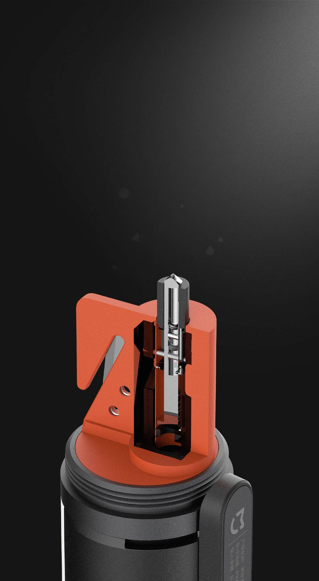 Ein schwarzes Gerät mit einer orangenen Öffnung und einem silbernen Mechanismus, vermutlich ein technisches Werkzeug oder Zubehör.