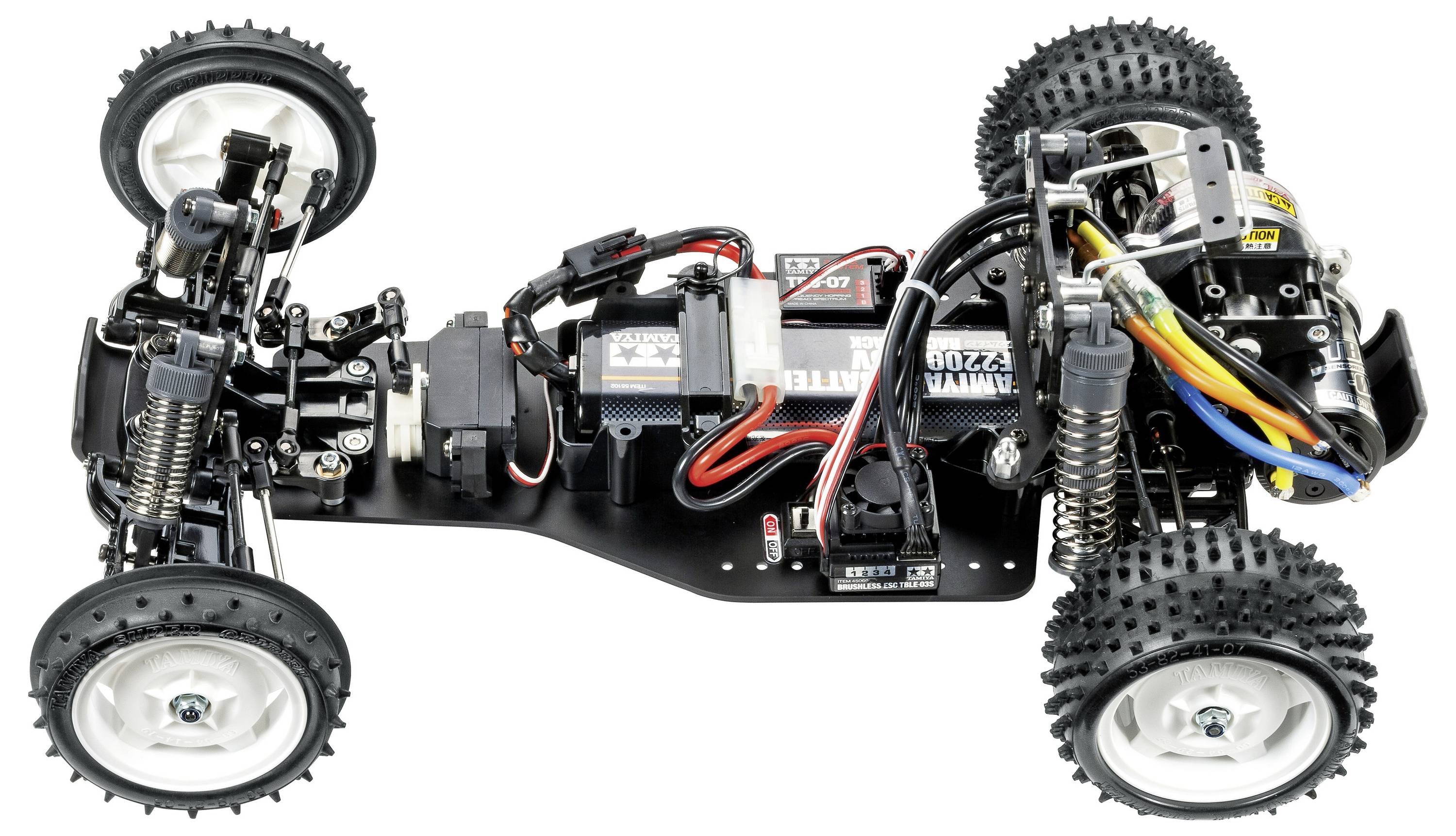 Fernsteuerbares Auto-Chassis mit offener Elektronik, Rädern mit Stollenreifen, Federung und sichtbaren Kabeln.