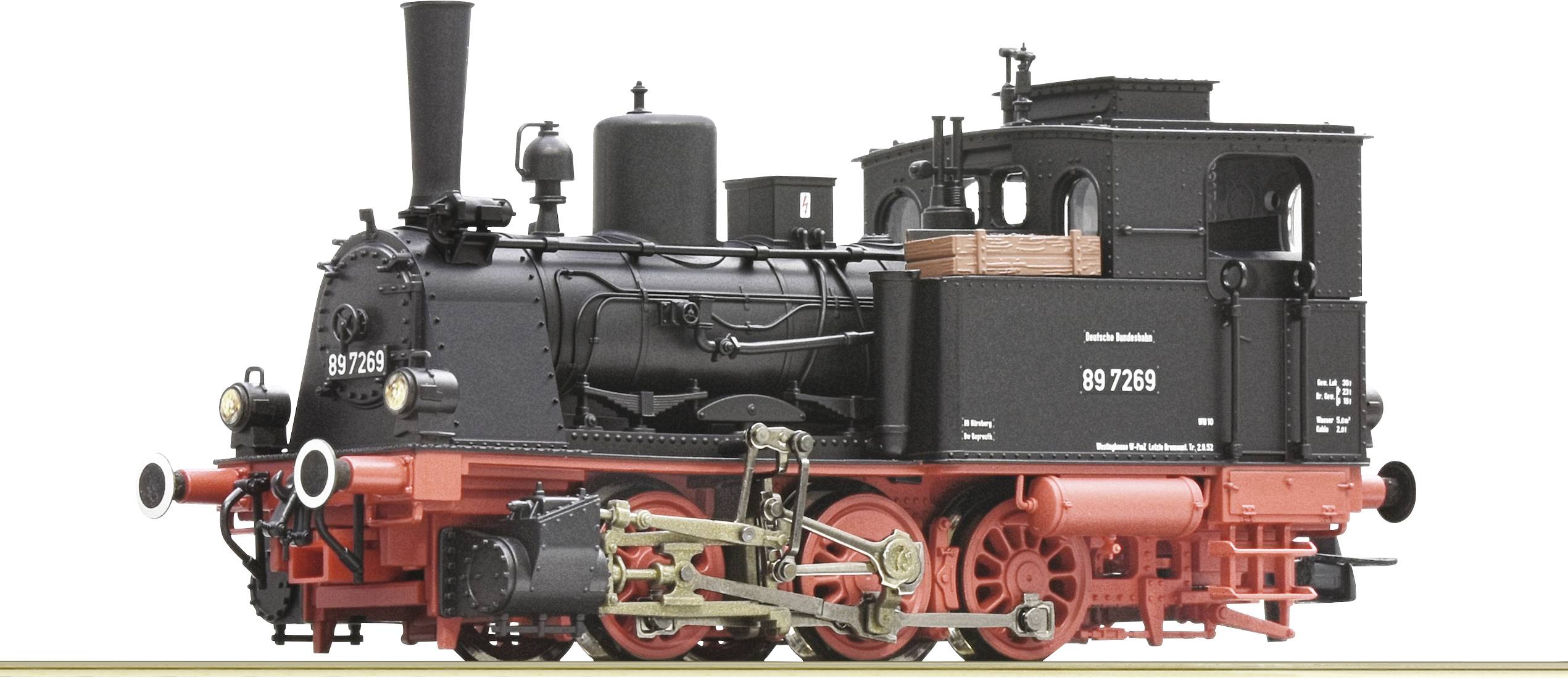 Schwarze Dampflokomotive mit der Beschriftung '89 7269'. Sie besitzt rote Räder und ein großes Schornsteinrohr, steht auf Gleisen.