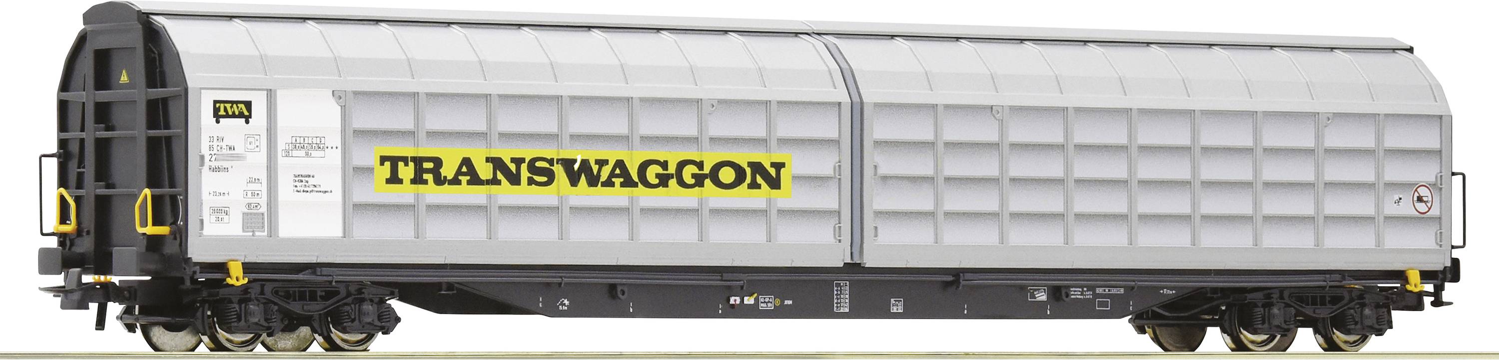 Grauer Güterwaggon mit 'TRANSWAGGON'-Logo in Schwarz und Gelb, seitlich fotografiert.