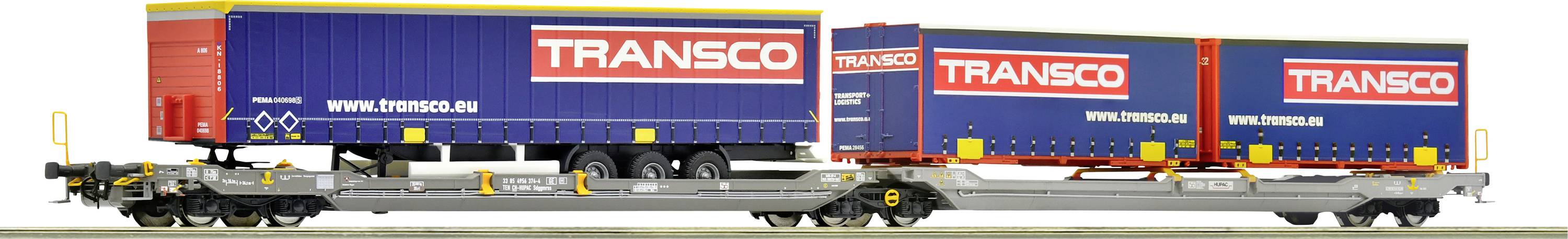 Zugwaggon mit zwei blauen TRANSCO-Containern, die auf einer grauen Plattform verladen sind.