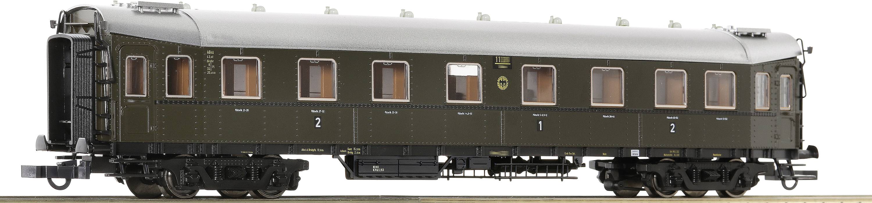 Ein brauner Eisenbahn-Personenwagen, historische Gestaltung mit mehreren Fenstern und Beschriftung '2. Klasse', detaillierte Ansichten.