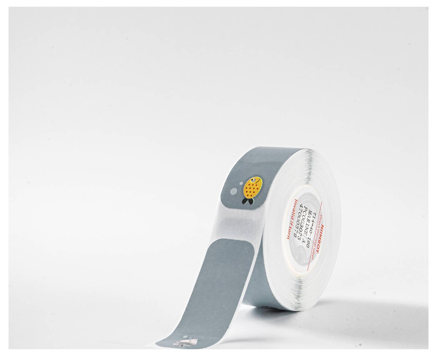 Rolle grauen Klebebands mit einem kleinen gelben Emoji in der Mitte.