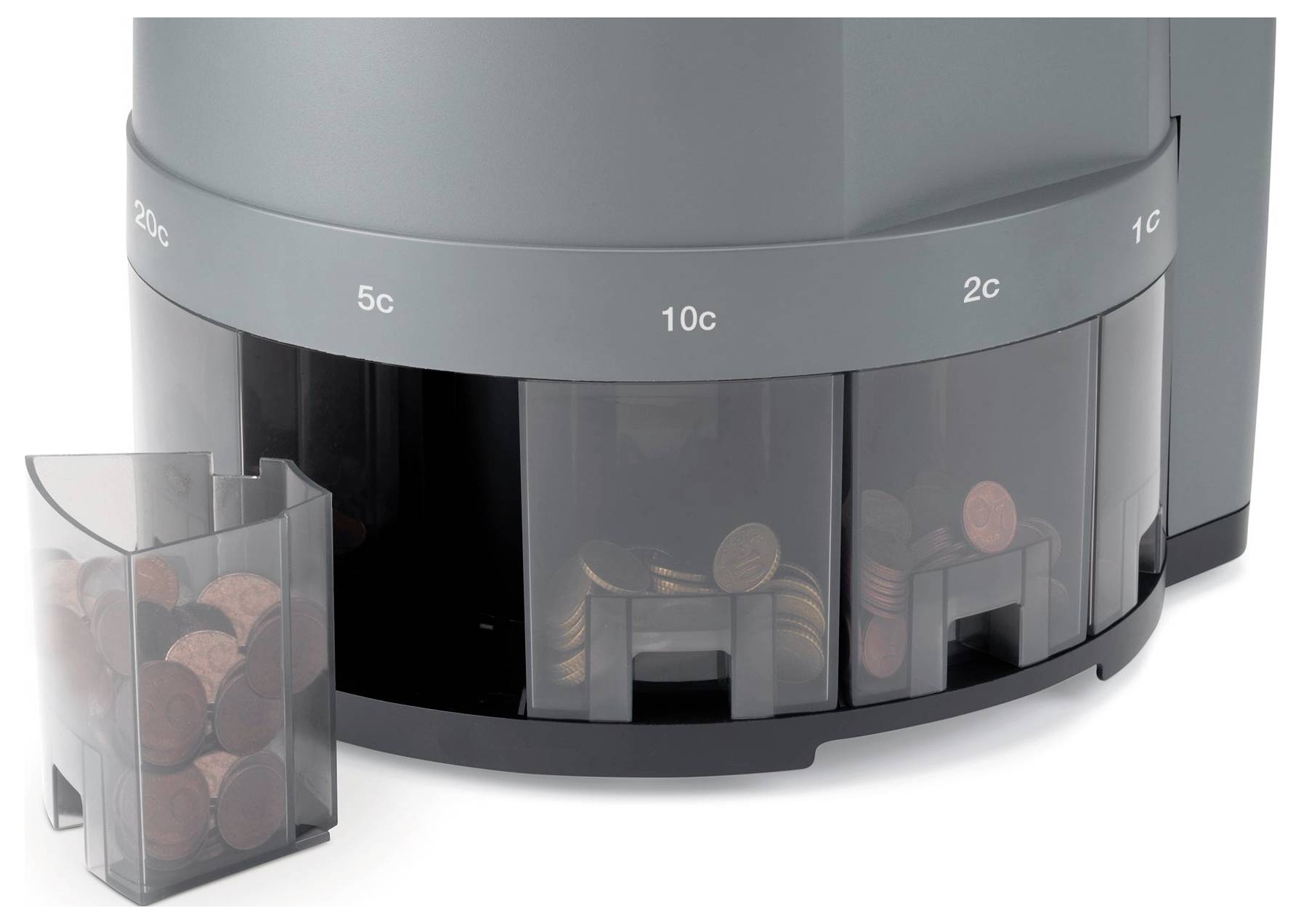 Ein Münzzähler trennt Münzen nach Wert in verschiedene Fächer. Links ein Fach mit gesammelten Münzen.