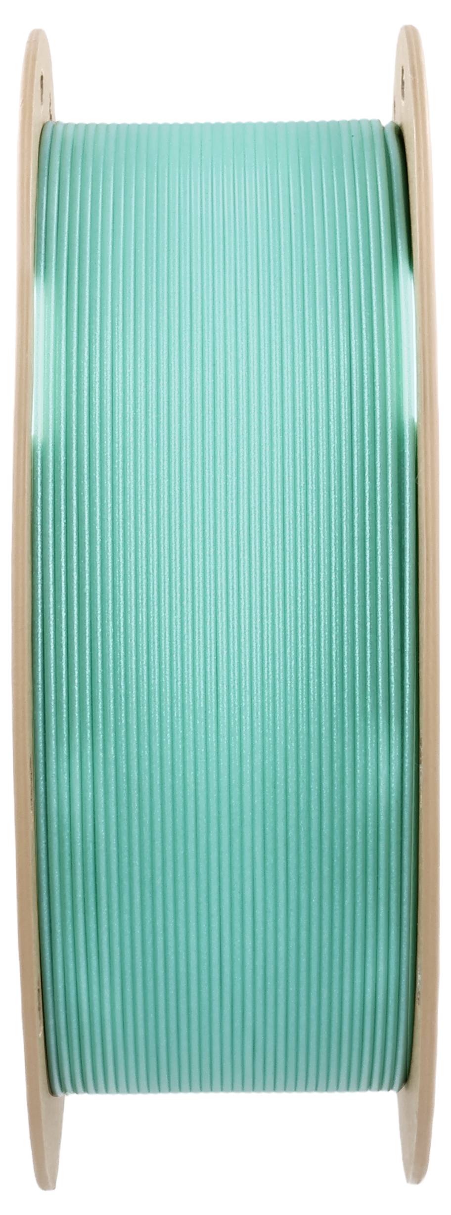 Eine Spule mit grünem 3D-Drucker-Filament, zur Herstellung von Kunststoffteilen in 3D-Druckern verwendet.