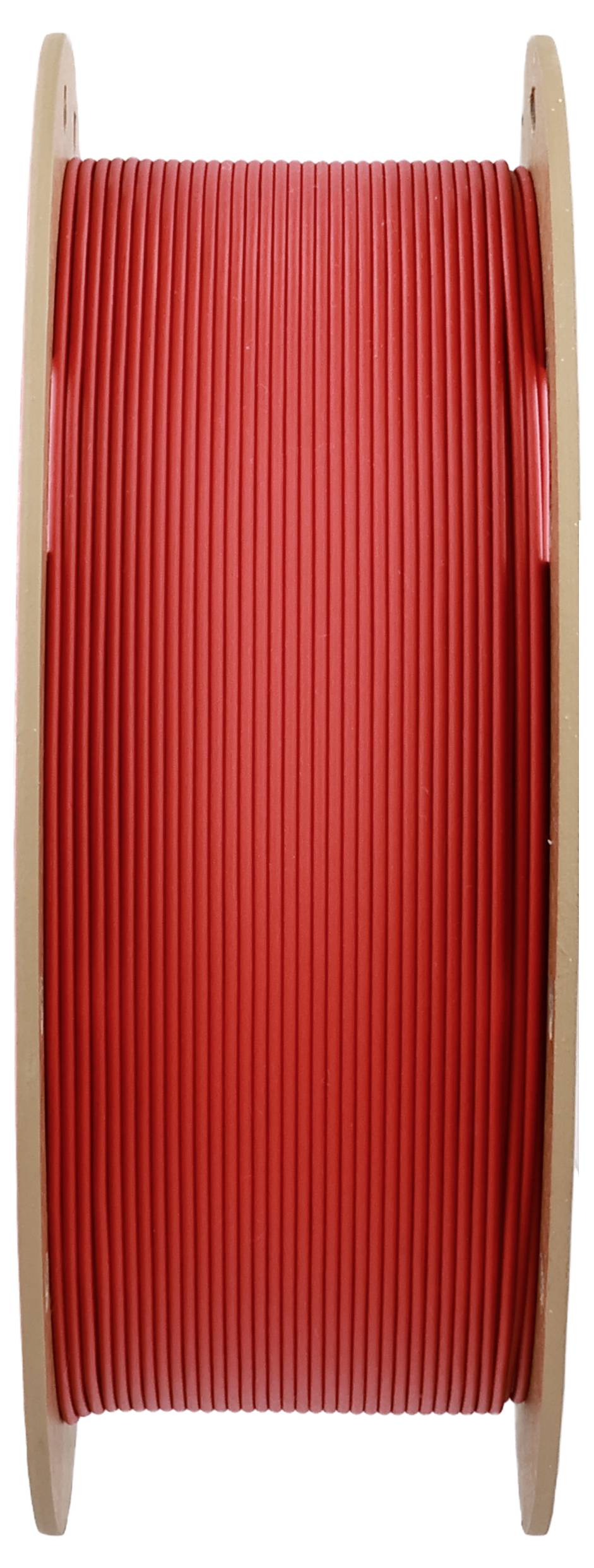 Eine große Spule roten Kabels, vertikal ausgerichtet, in Seitenansicht.