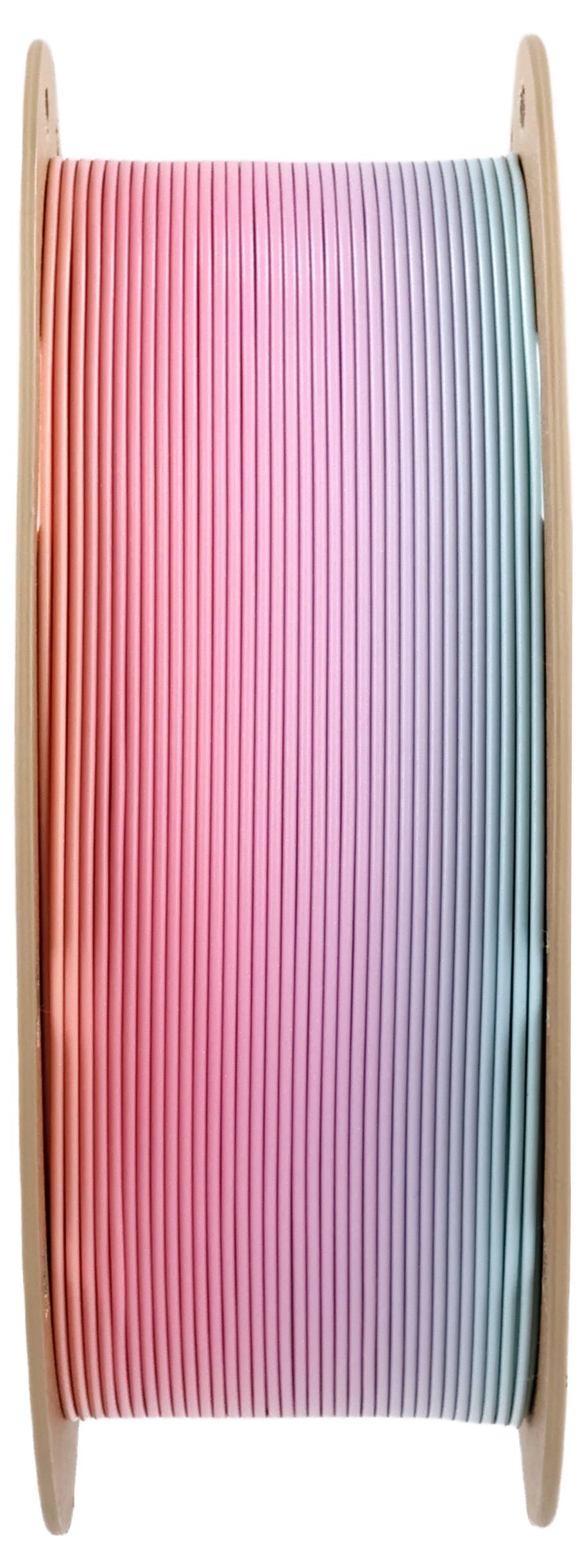 Spule mit mehrfarbigem Filament von Rosa über Lila zu Blau, verwendet für 3D-Druck.