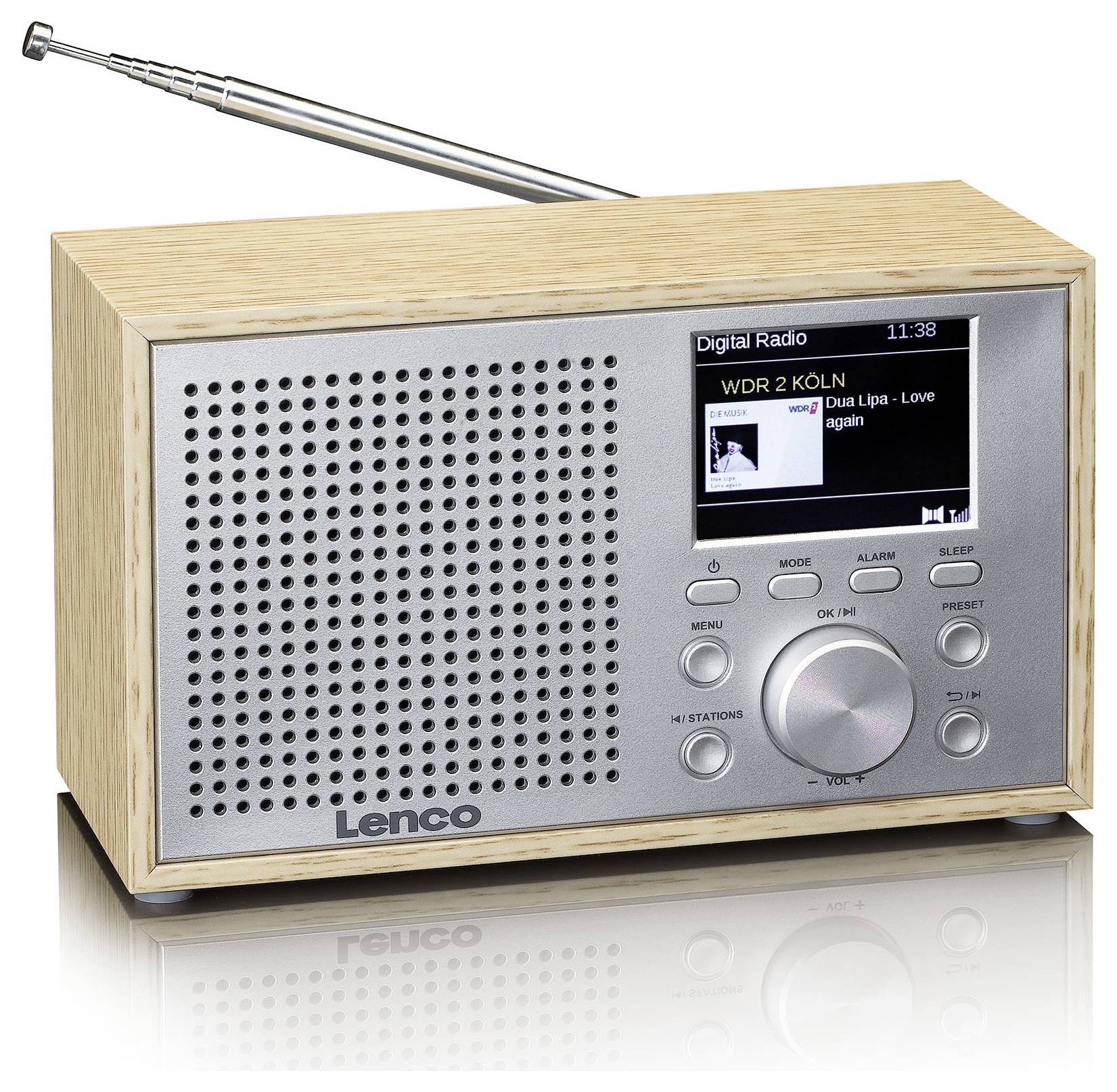 Ein Digitalradio mit Holzrahmen, zeigt 'WDR 2 KÖLN' und 'Dua Lipa - Love Again' auf dem Display. Mehrere Knöpfe und Antenne sichtbar.