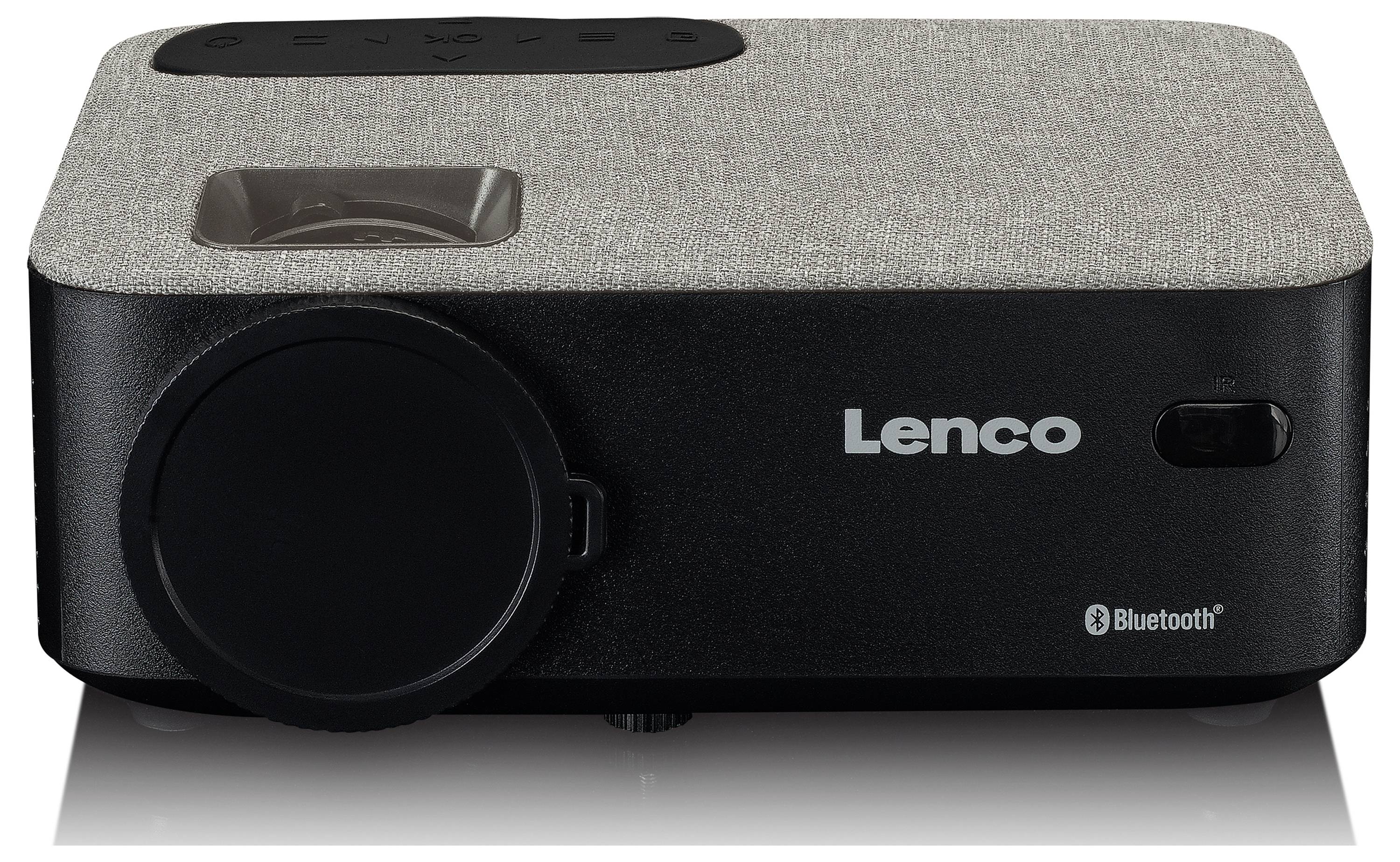Ein grauer Lenco Projektor mit schwarzem Rand und Bluetooth-Logo. Links befindet sich die Projektorlinse, rechts das Lenco-Logo.