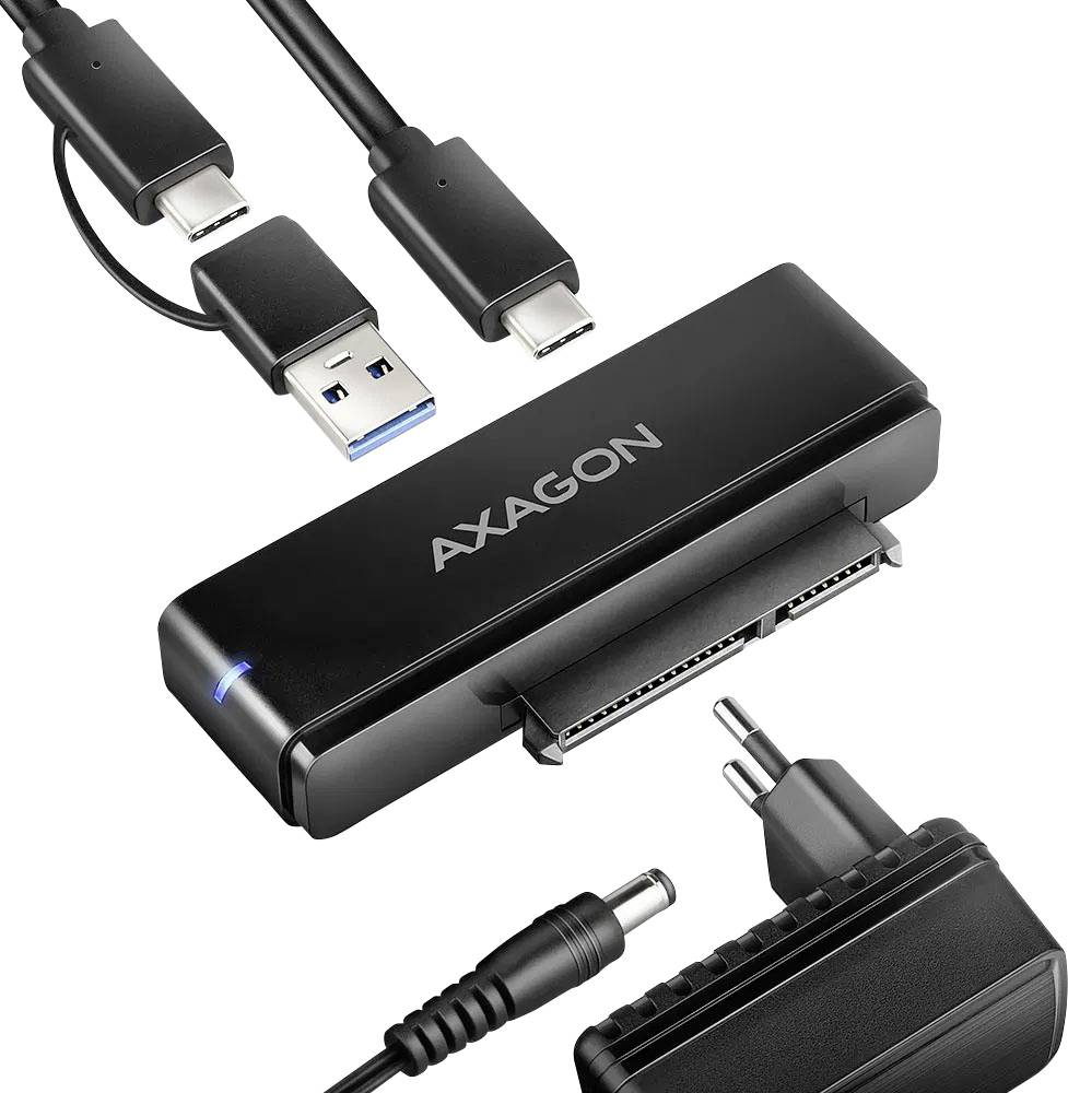 Externes Festplatten-Dock mit Kabeln und Netzteil. Unterstützt USB und USB-C Verbindungen für Datenübertragung und Stromversorgung.