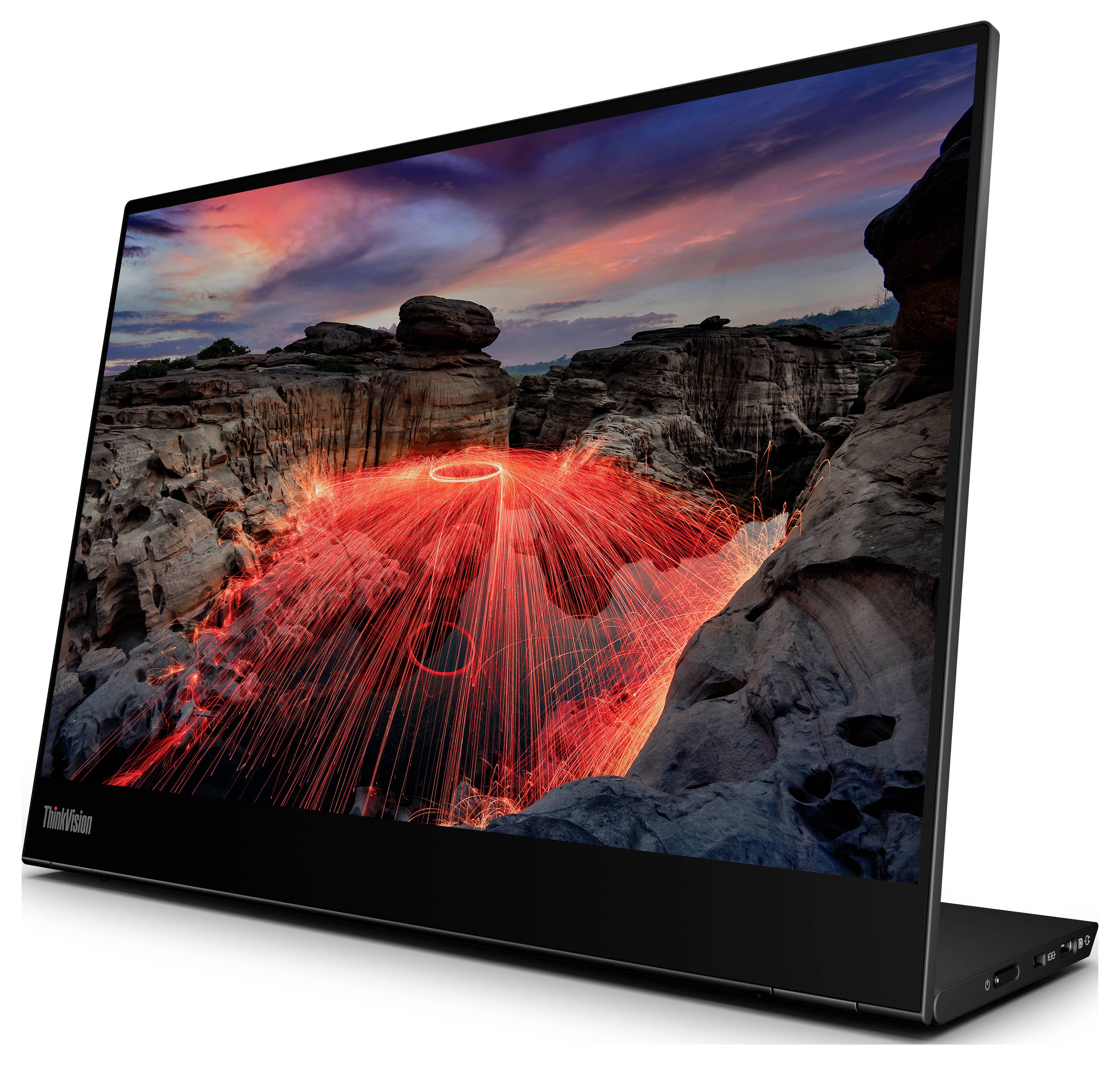 Ein Laptop mit einem hochauflösenden Display zeigt ein Bild von einem Canyon bei Sonnenuntergang und Lichtspuren eines Stahlwolle-Spinnens.