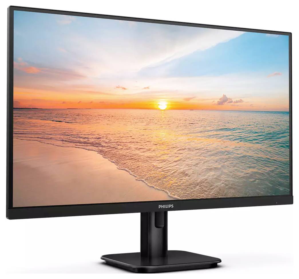 Ein PC-Monitor zeigt einen Sonnenuntergang über einem ruhigen Strand, mit einem klaren Himmel und sanften Wellen im Meer.
