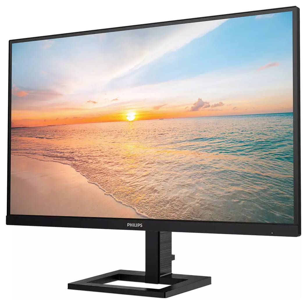 Ein Monitor zeigt eine Landschaft mit einem Sonnenuntergang über dem Meer. Der Himmel ist teils bewölkt und das Wasser ruhig.