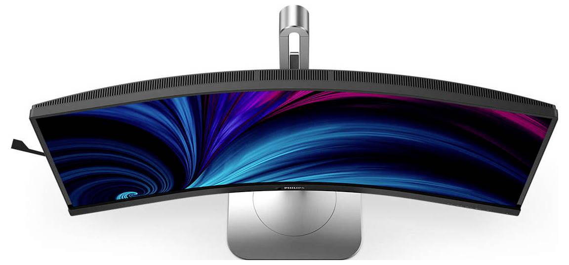 Ein gebogener Monitor von oben gesehen, mit einem farbigen, abstrakten Display in Blau- und Pinktönen, auf einem silbernen Standfuß.