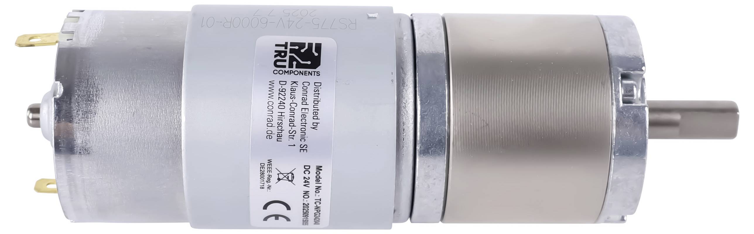 Ein zylindrischer Elektromotor aus Metall mit beschrifteten weißen und metallischen Komponenten, elektrischen Anschlüssen an einem Ende und einer rotierenden Welle am anderen Ende.