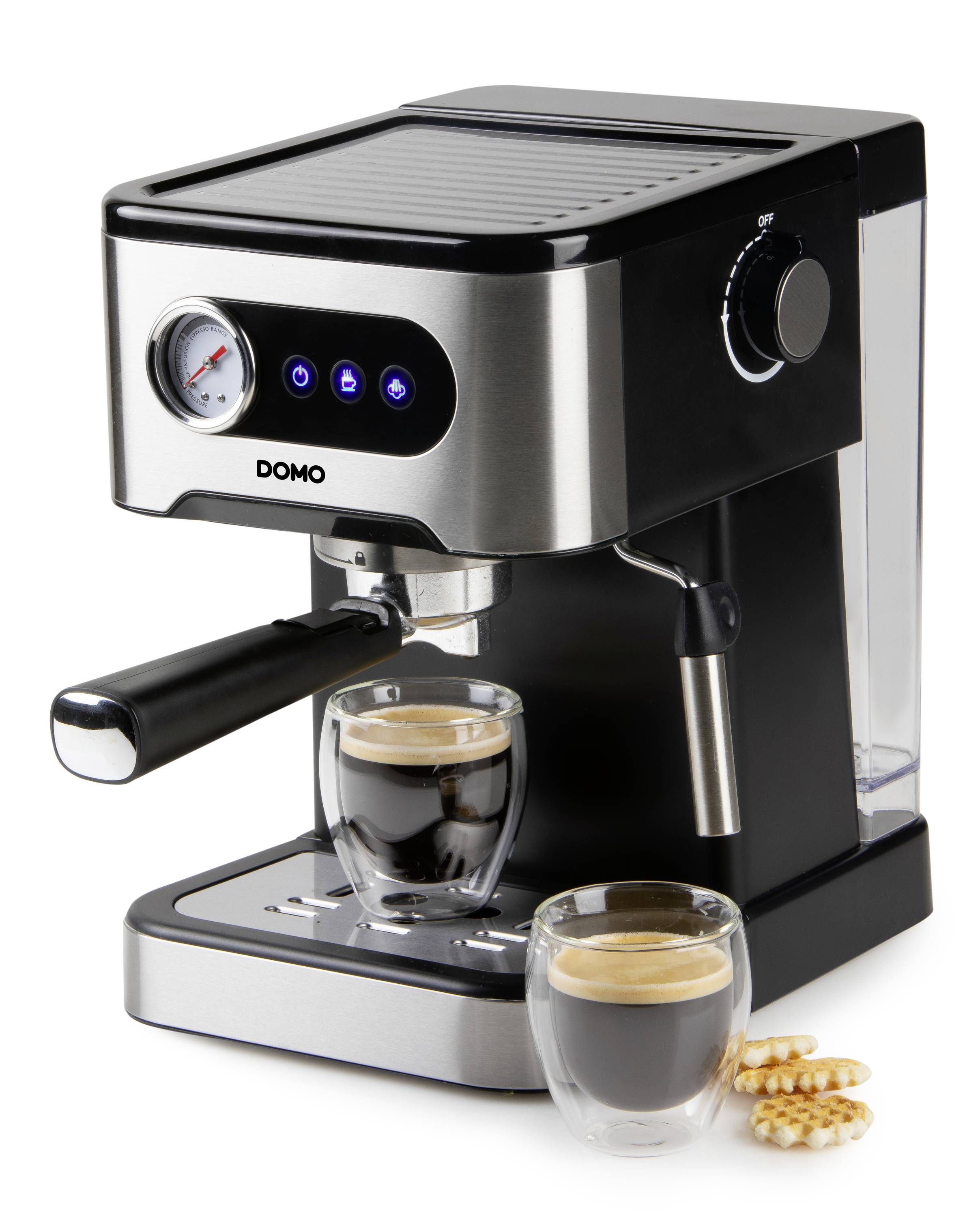 Eine schwarze Espressomaschine mit zwei Tassen gefülltem Espresso auf der Tropfschale. Daneben liegen zwei Kekse.
