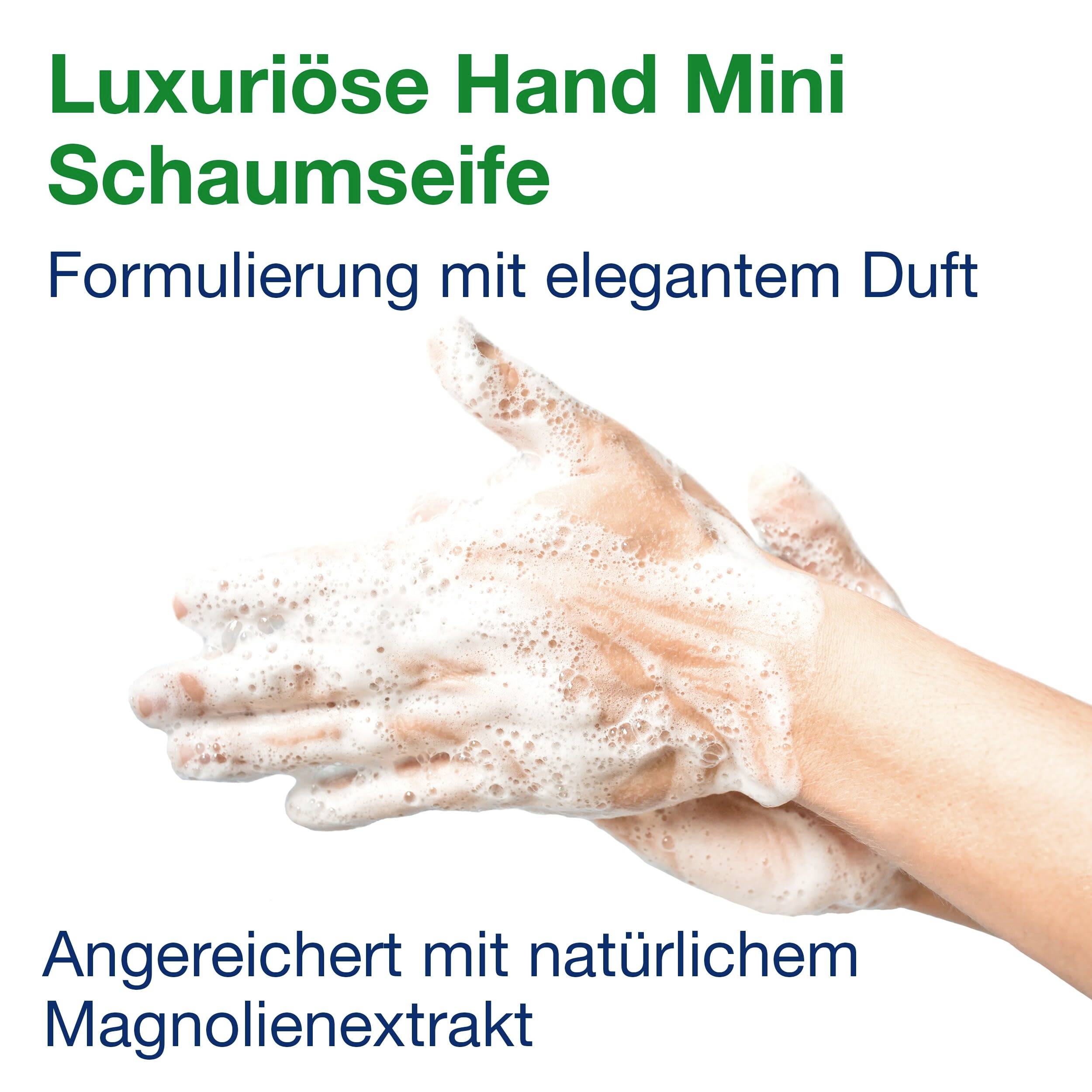 Zwei Hände mit Schaum. Text: 'Luxuriöse Hand Mini Schaumseife', 'Formulierung mit elegantem Duft', 'Angereichert mit natürlichem Magnolienextrakt'.
