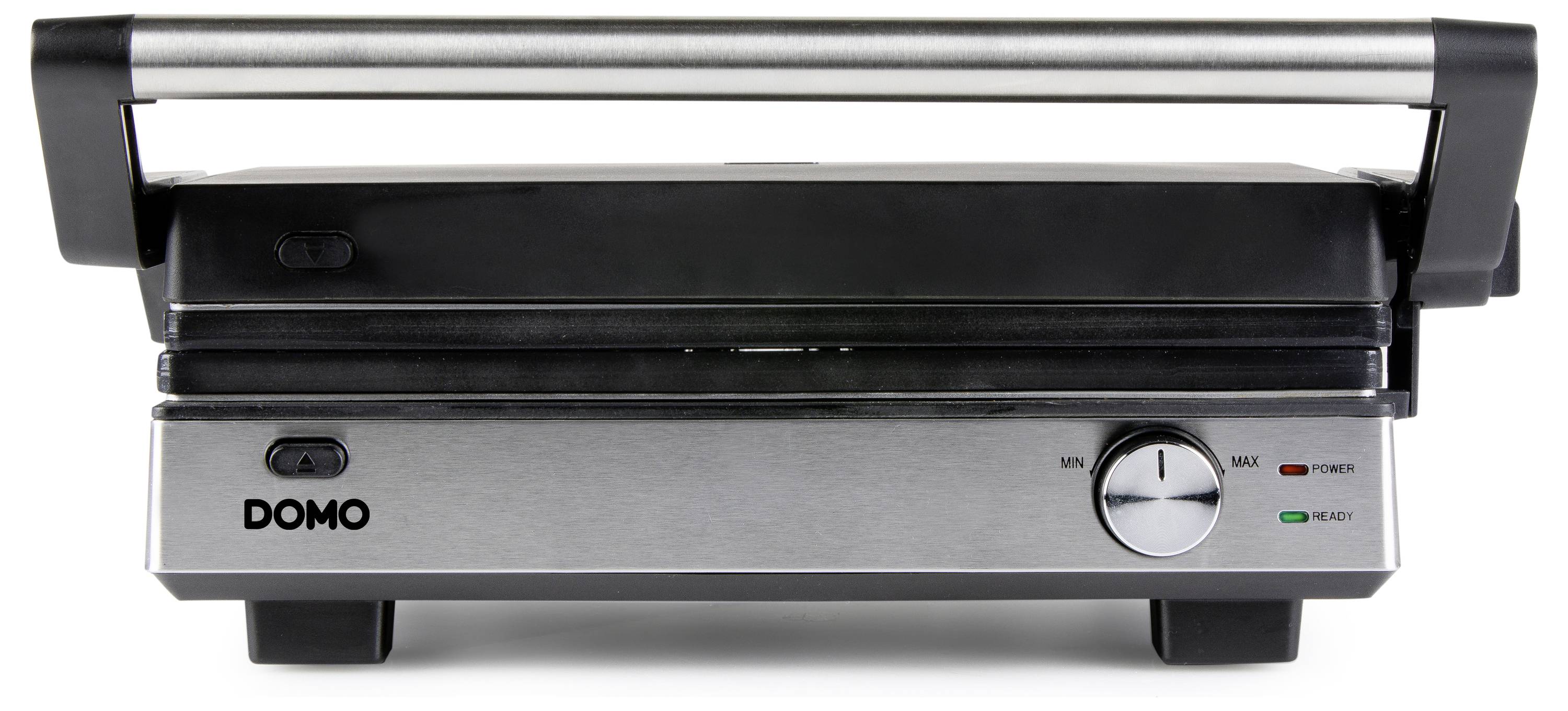 Ein elektrisches Kontaktgrillgerät mit silberner und schwarzer Oberfläche, Temperaturregler und Kontrollleuchten auf einer Küchenarbeitsplatte.