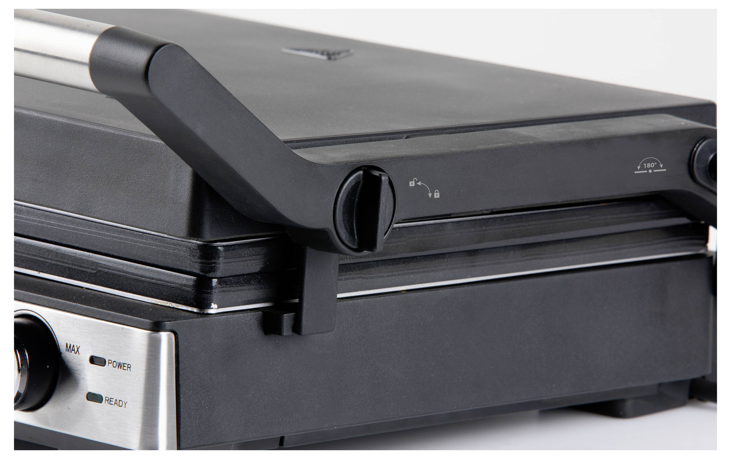 Geschlossener Kontaktgrill aus Metall mit schwarzem Gehäuse und verstellbarem Griff.
