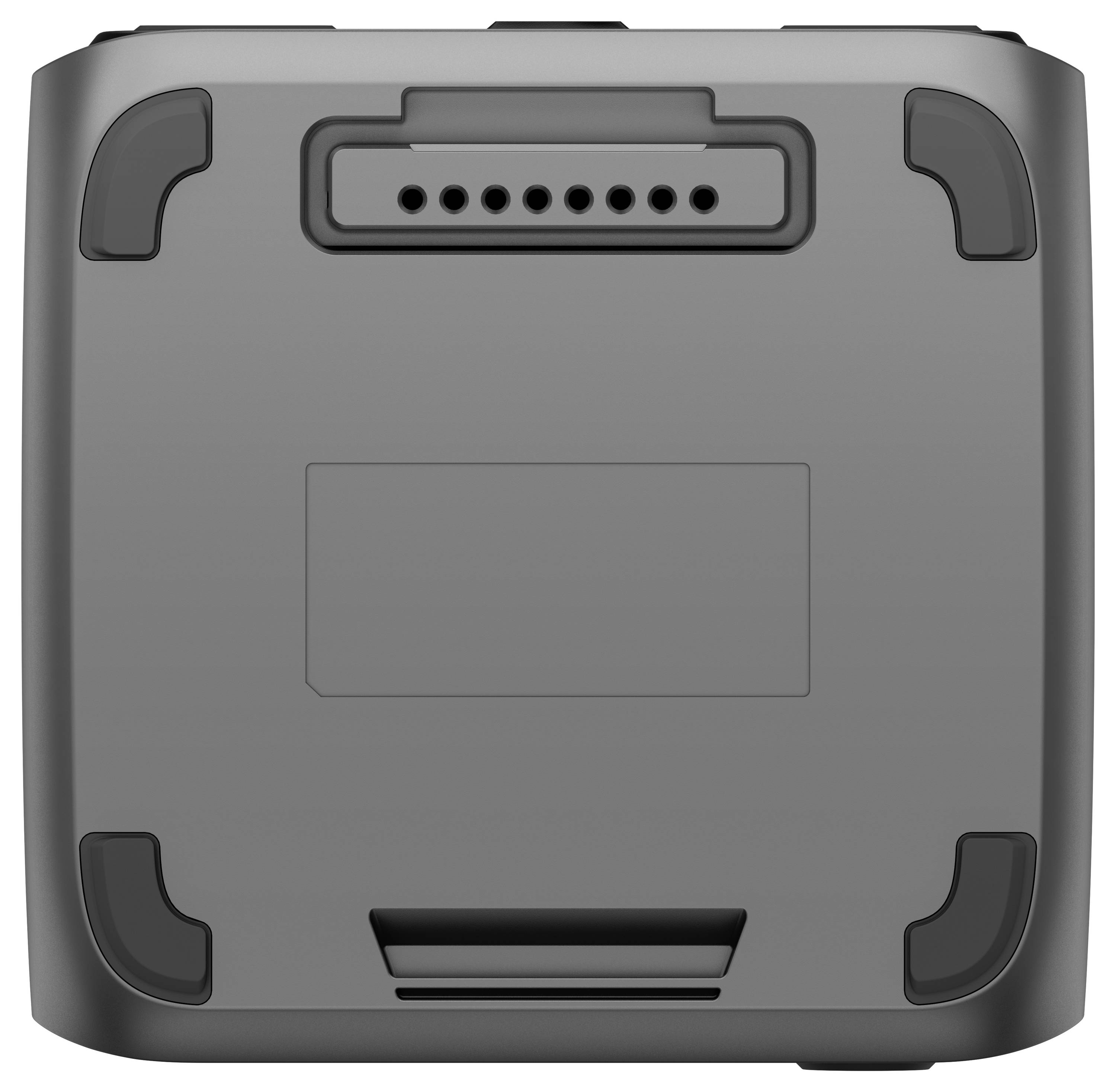 Quadratisches, graues Gerät mit abgerundeten Ecken und Lüftungsschlitzen oben, wahrscheinlich Unterseite eines elektronischen Geräts.