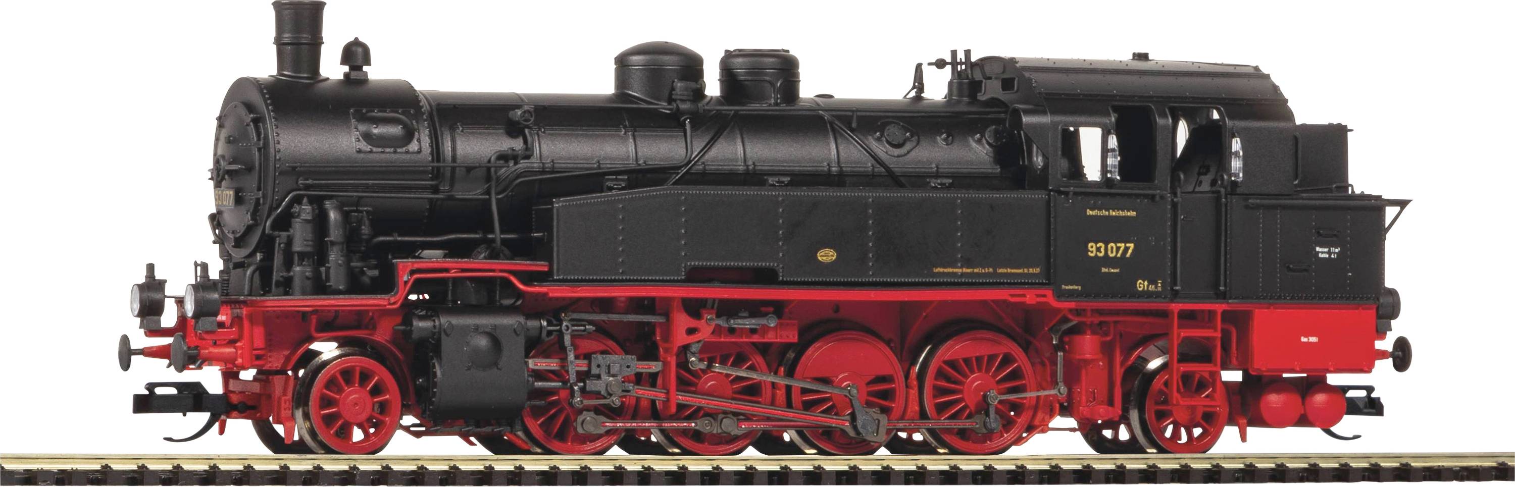 Eine schwarze Dampflokomotive mit roten Details und rotierenden Rädern steht auf Gleisen. Sie wirkt nostalgisch und kraftvoll.
