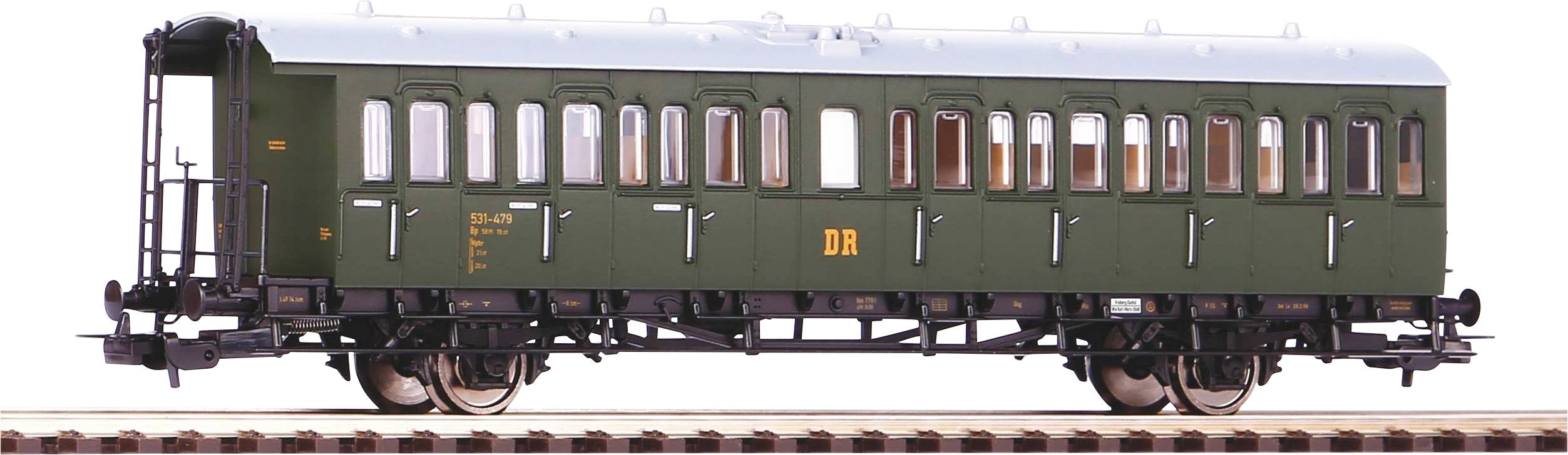 Modelleisenbahnwagen in dunkelgrün mit DB-Logo, auf Gleisen. Detaillierte Fenster und Dachstruktur sind sichtbar.