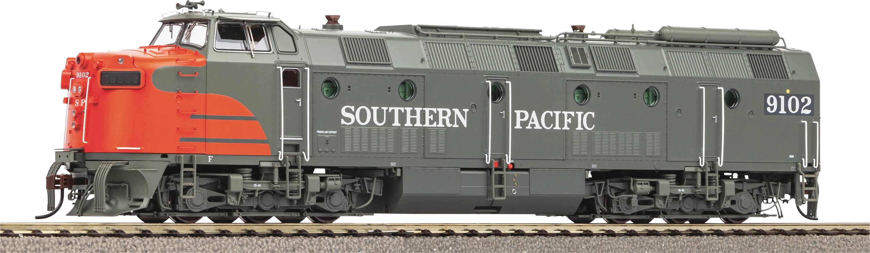 Ein Modell eines Southern Pacific Zuges, Seitenansicht, grau mit orangen Details, auf einem Gleis platziert.