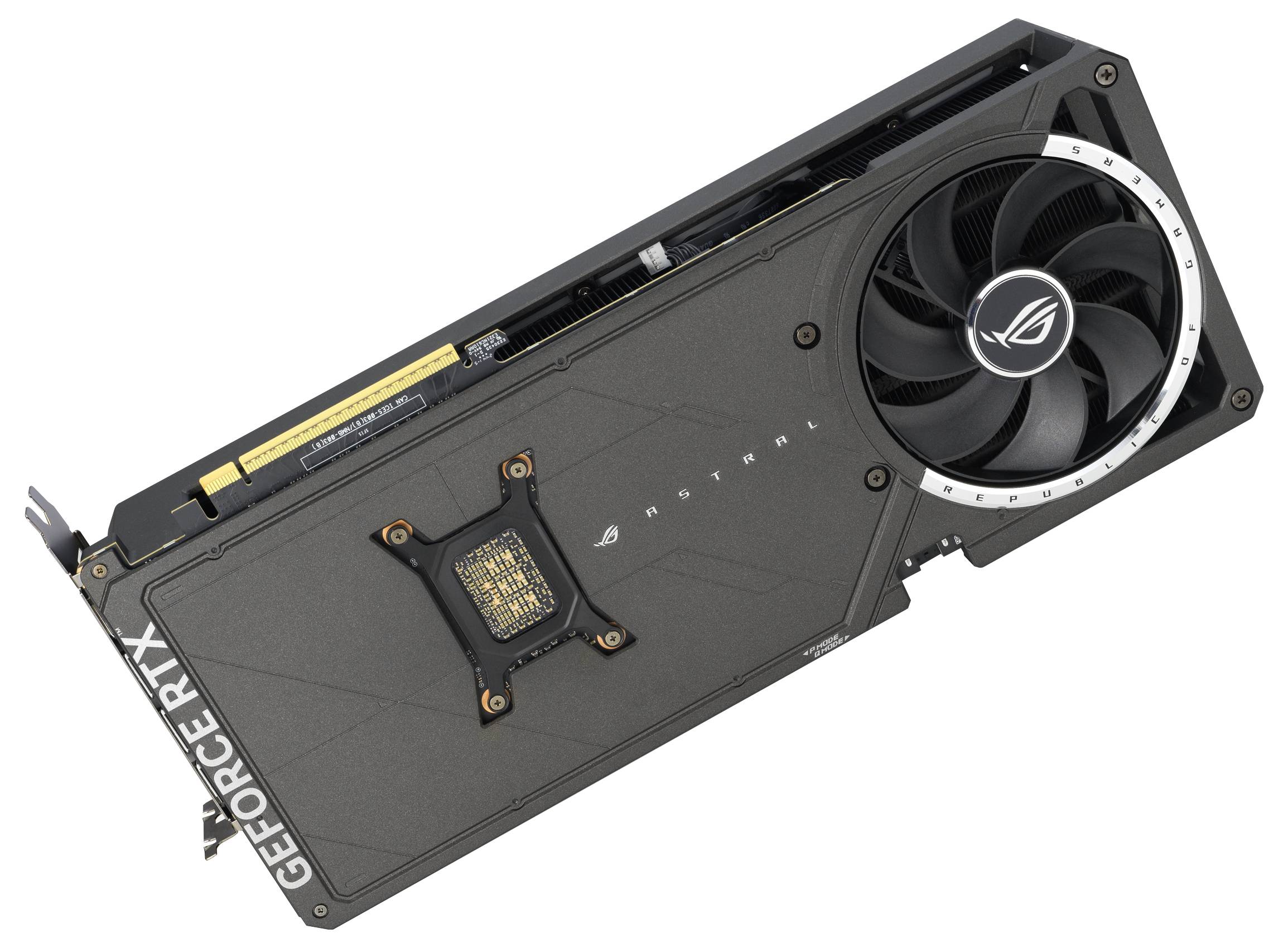 Eine schwarze Grafikkarte von ASUS mit großen Lüftern, Modell ROG Strix RTX, liegt diagonal auf der Seite.