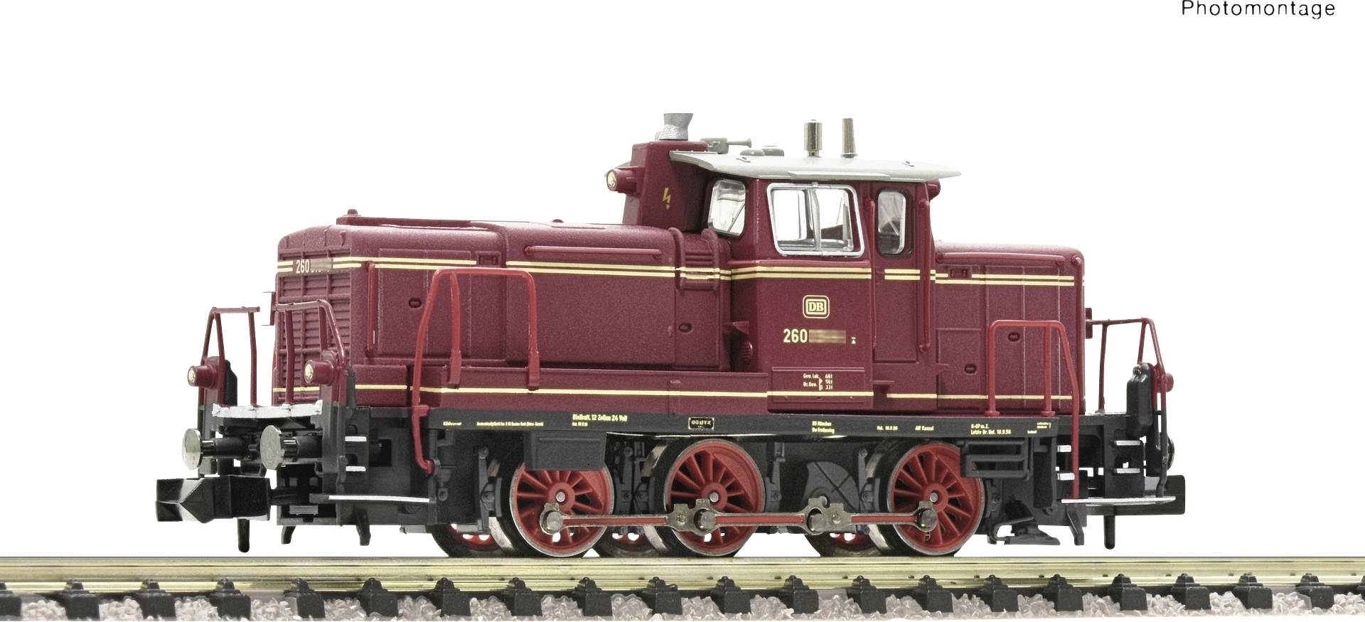 Ein rotes Modell einer Rangierlokomotive mit der Aufschrift '240', auf einem Eisenbahngleis stehend.