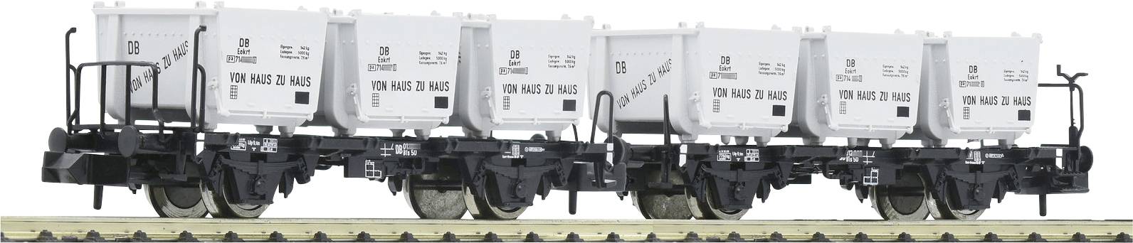 Ein Güterwagen mit sechs weißen Containern, die mit '100 Jahre VTG Pauls' beschriftet sind, steht auf einem Gleis. Transportbezogen.