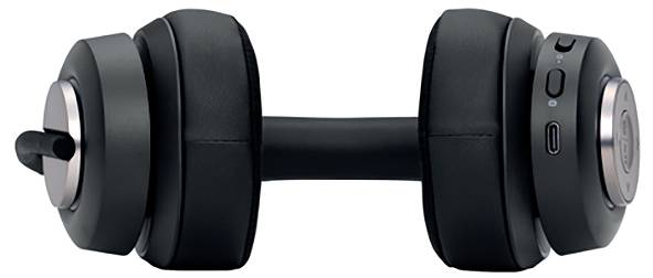 Ein schwarzes Paar Over-Ear-Kopfhörer liegt auf einer weißen Oberfläche. Sichtbare Tasten zur Steuerung und ein Ladeanschluss.