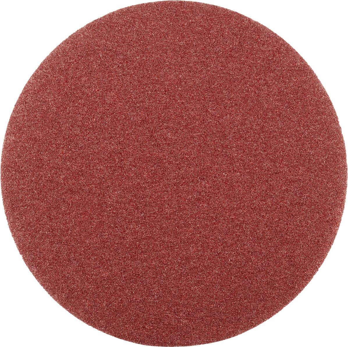 Runde rote Schleifscheibe in Nahaufnahme, verwendet zum Glätten von Oberflächen in der Holzbearbeitung oder Metallverarbeitung.