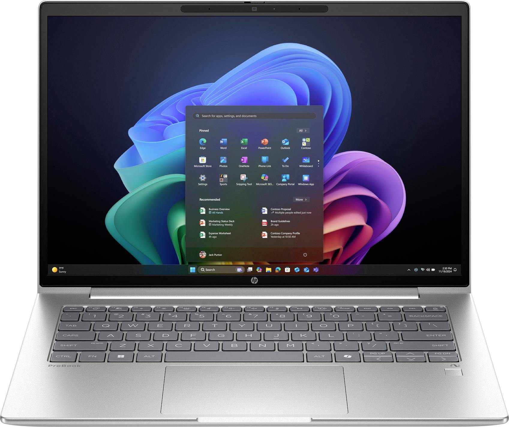 Ein Laptop mit geöffnetem Startmenü von Windows 11, auf dem Display bunte Grafiken. Die Tastatur ist gut sichtbar.