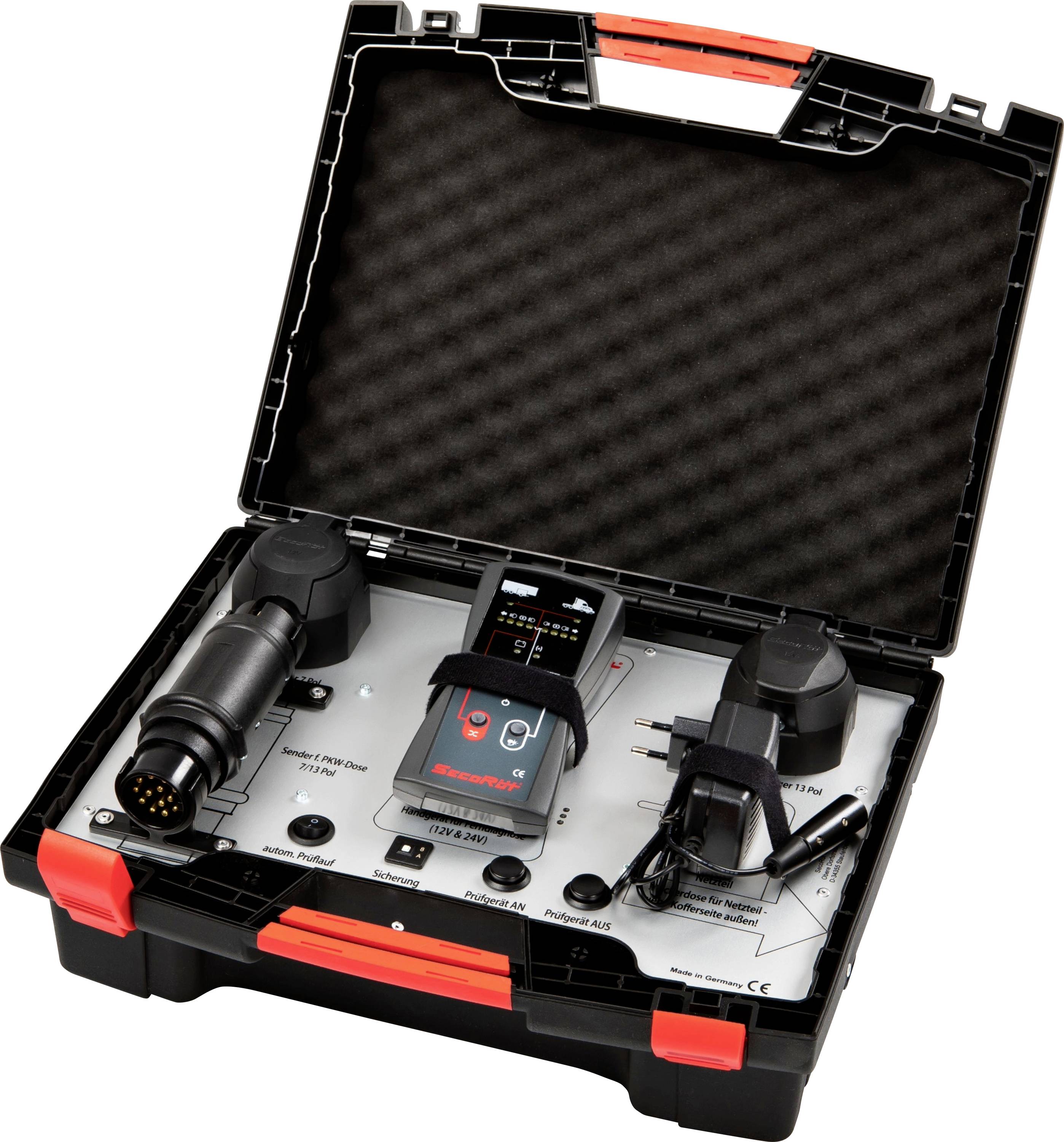 Ein offener schwarzer Werkzeugkoffer mit elektronischen Prüfgeräten und Kabeln, bereitgestellt für Diagnosetests und Reparaturen.