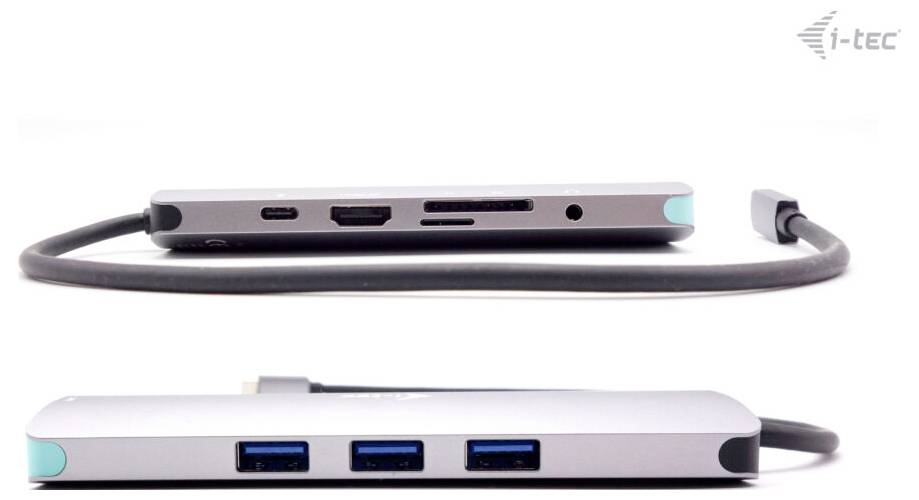 USB-C-Hub mit mehreren Anschlüssen, einschließlich HDMI, USB-A und USB-C, von i-tec. Silbergraues Design mit abgerundeten Ecken.