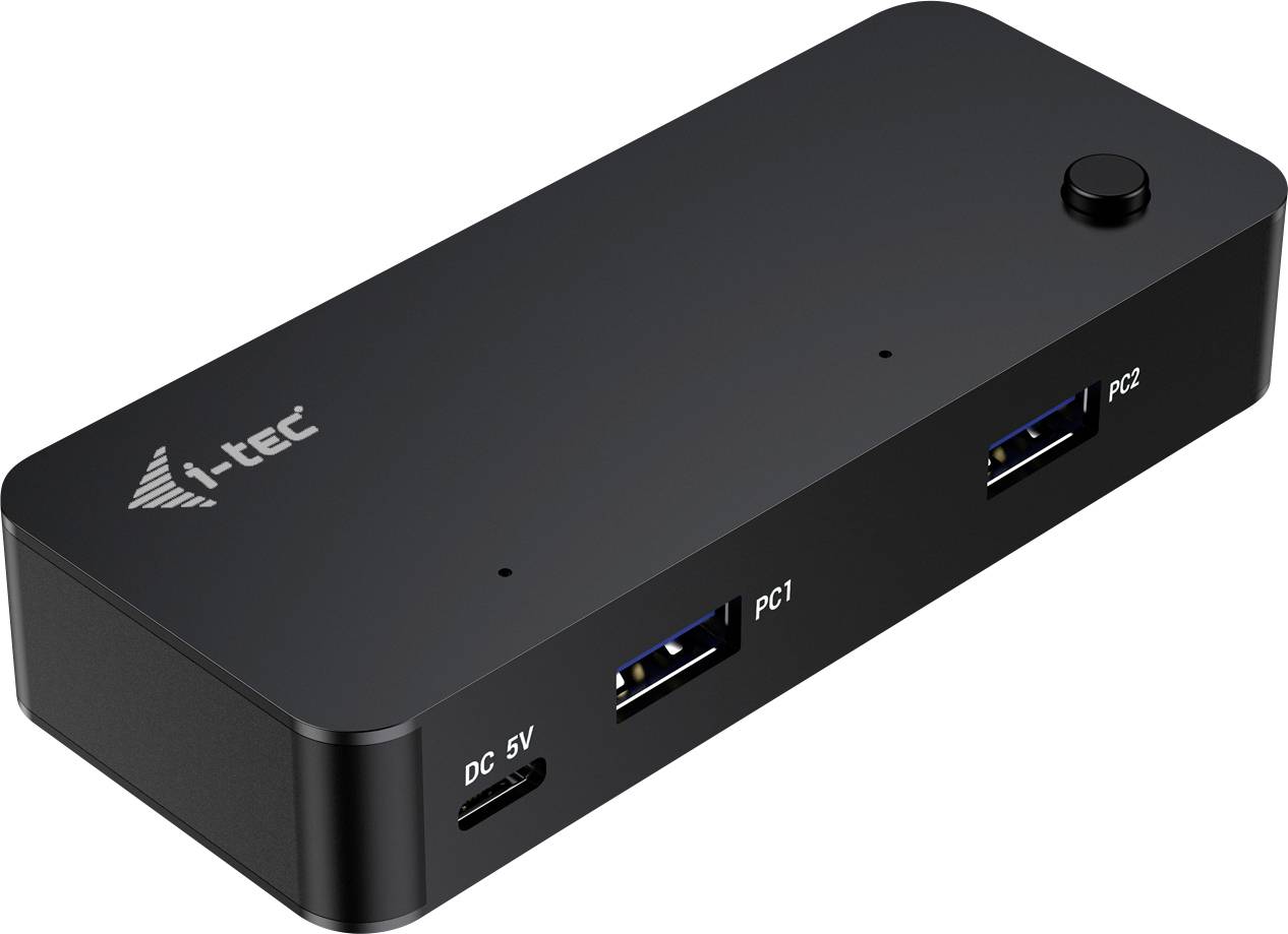 Schwarze USB-Dockingstation mit zwei USB-Ports, beschriftet 'PC1' und 'PC2', sowie einem Netzteilanschluss 'DC 5V'.