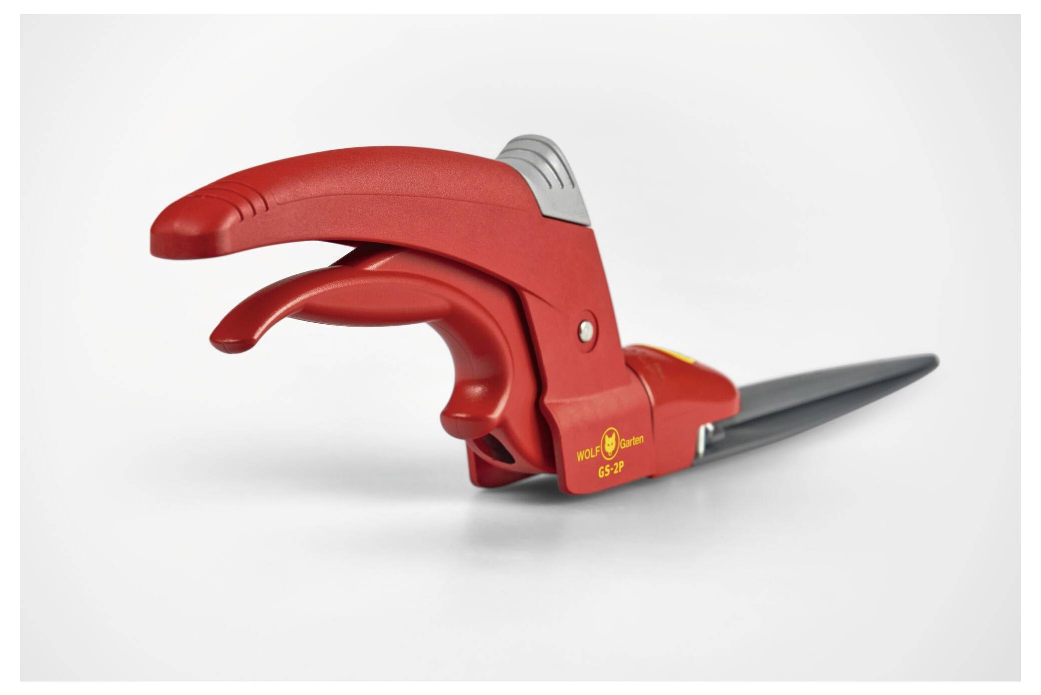 Rote, handbetätigte Grasschere mit ergonomischem Griff und schwarzer Klinge, ideal für präzises Schneiden von Rasenkanten.