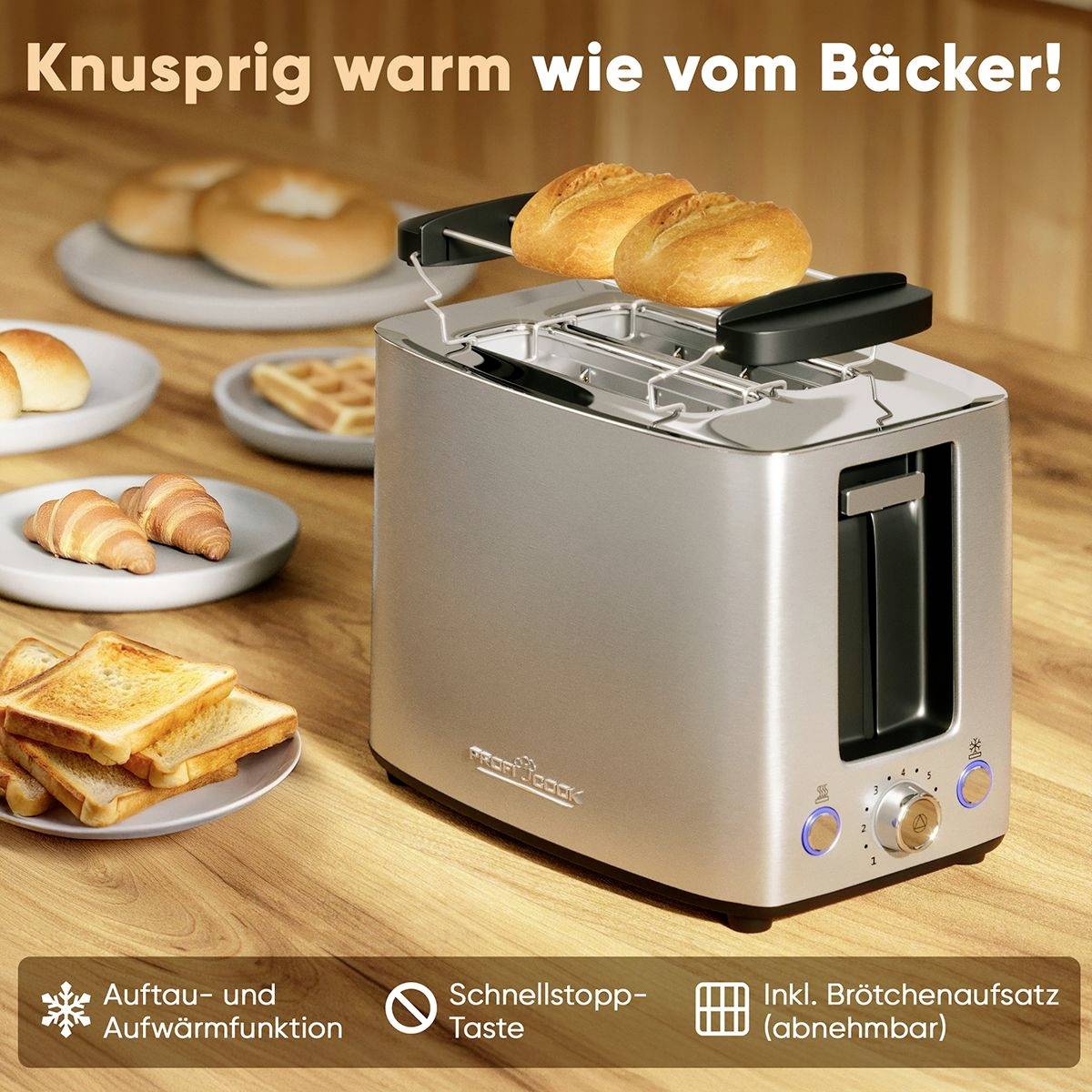 Ein Toaster mit Brötchenaufsatz; zwei Brötchen oben. Text: 'Knusprig warm wie vom Bäcker!'. Funktionen: Aufwärmen, Schnellstopp.