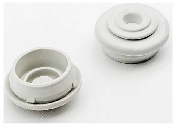 Zwei weiße Plastikknöpfe mit runder Form auf einer weißen Oberfläche.