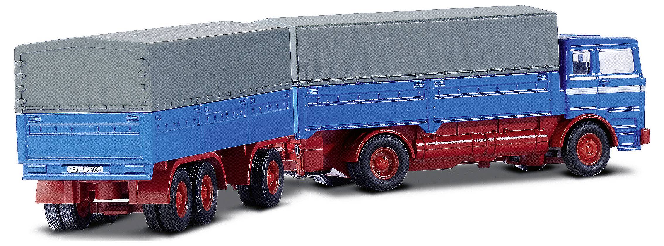 Ein blauer Modell-Sattelschlepper mit grauen Planen und roten Rädern zeigt ein klassisches Lkw-Design.