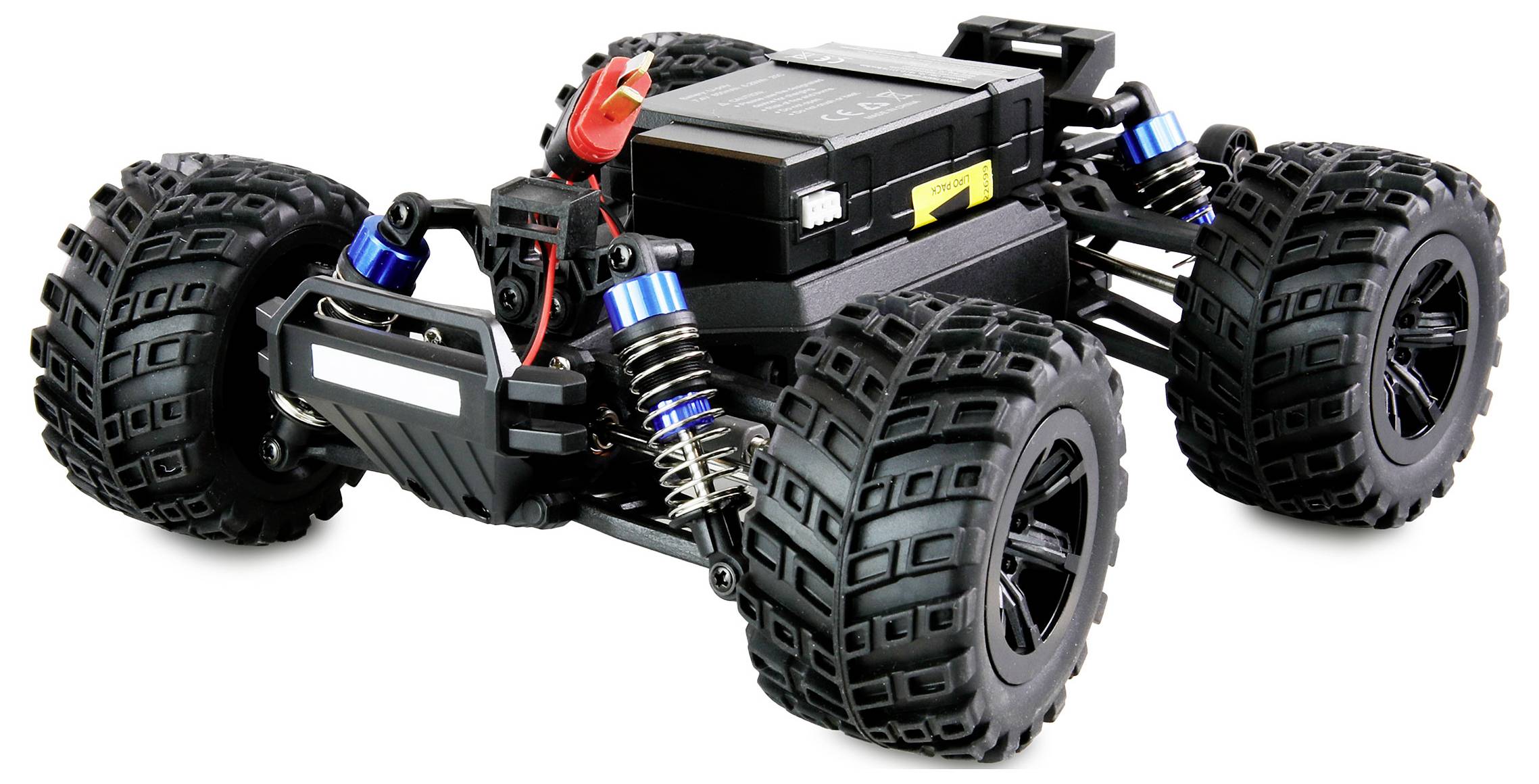 Ein ferngesteuertes Auto mit vier großen, grobstolligen Reifen und sichtbaren Stoßdämpfern. Es hat eine robuste schwarze Karosserie.