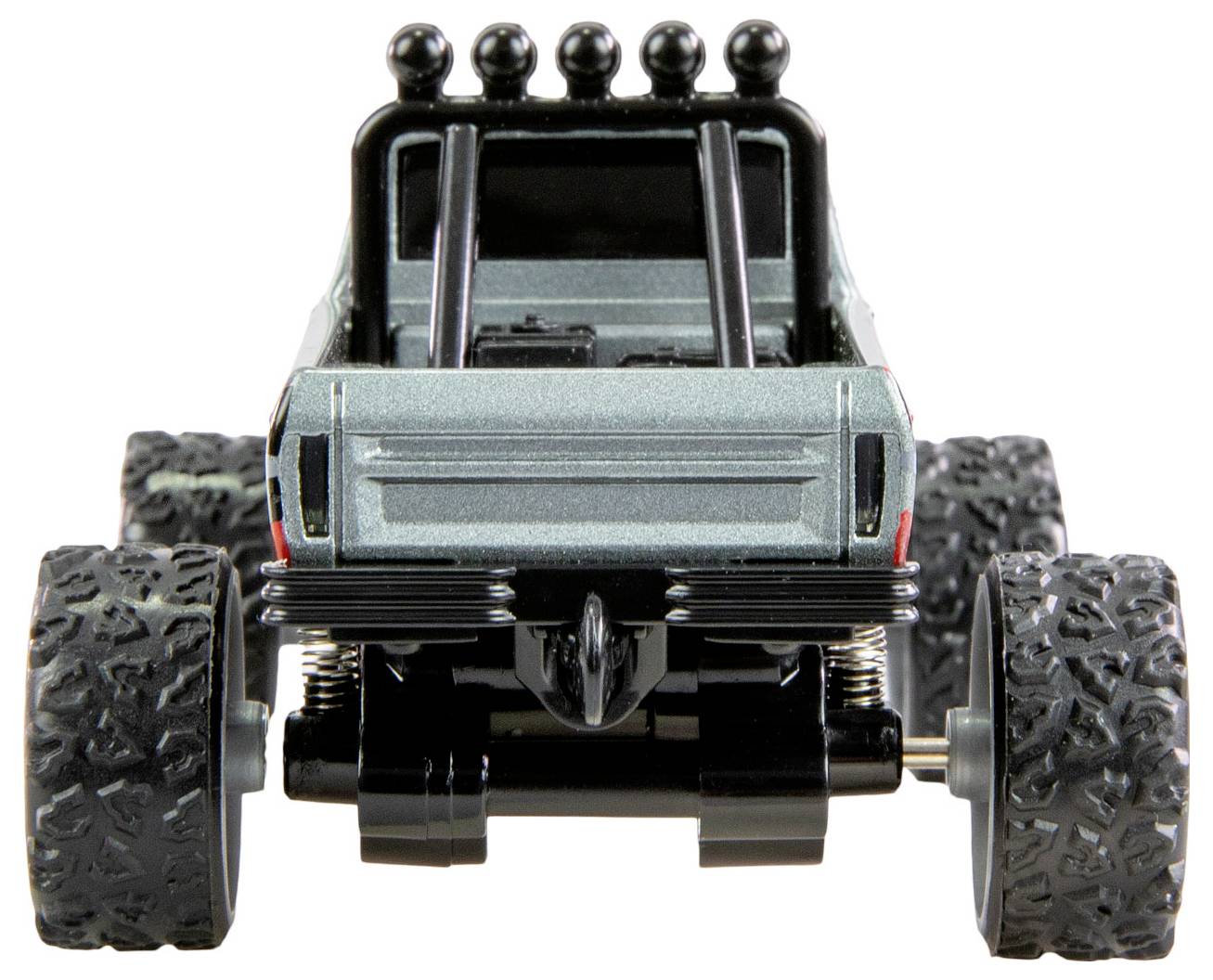 Ein Spielzeug-Monstertruck von hinten, mit großen grobstolligen Reifen und einer grauen Karosserie, bereit für Offroad-Abenteuer.