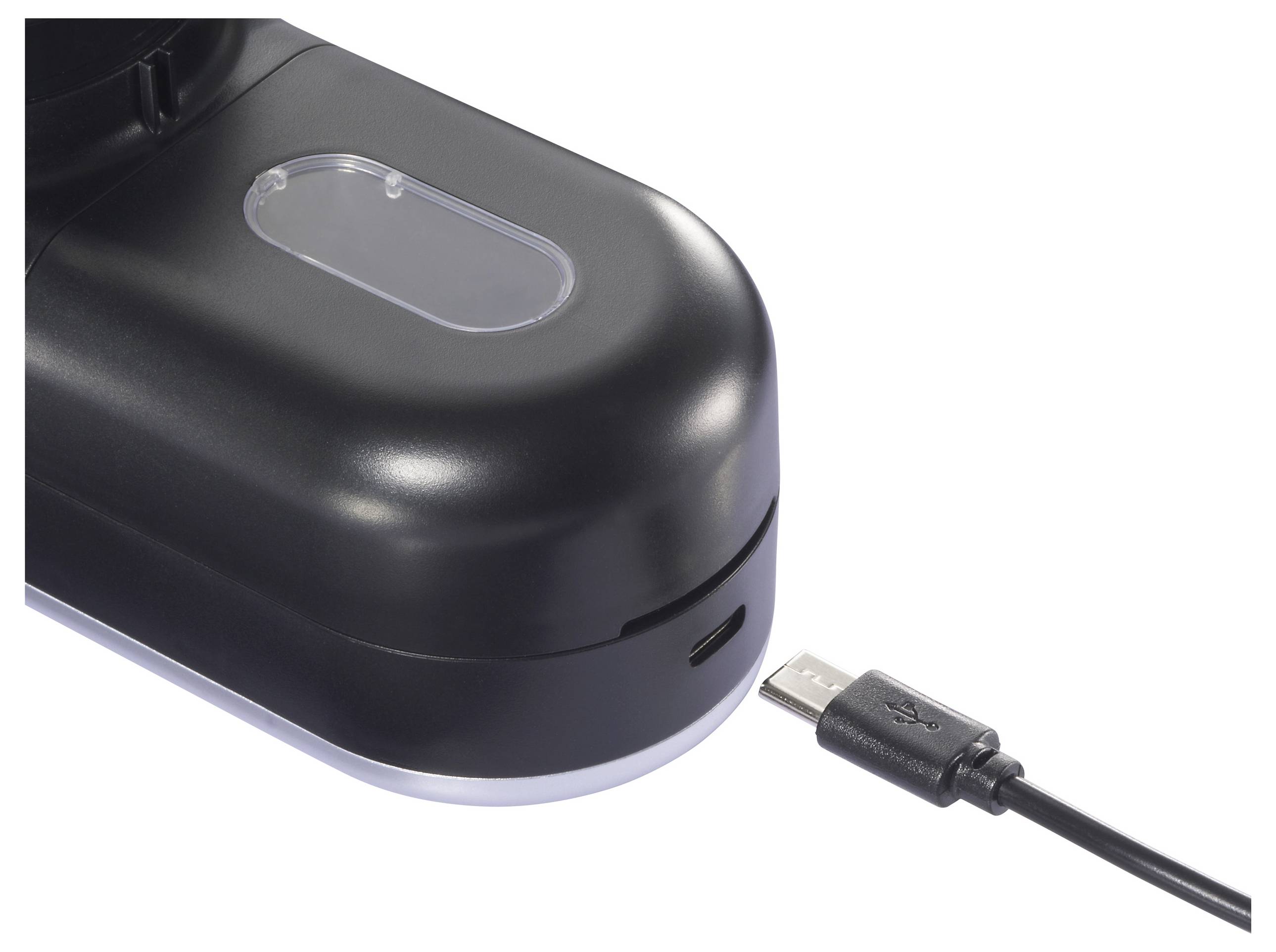 Ein schwarzes elektronisches Gerät weist einen transparenten Abschnitt an der Oberseite auf. Daneben liegt ein USB-Kabel, so positioniert, dass es in das Gerät eingesteckt werden kann.