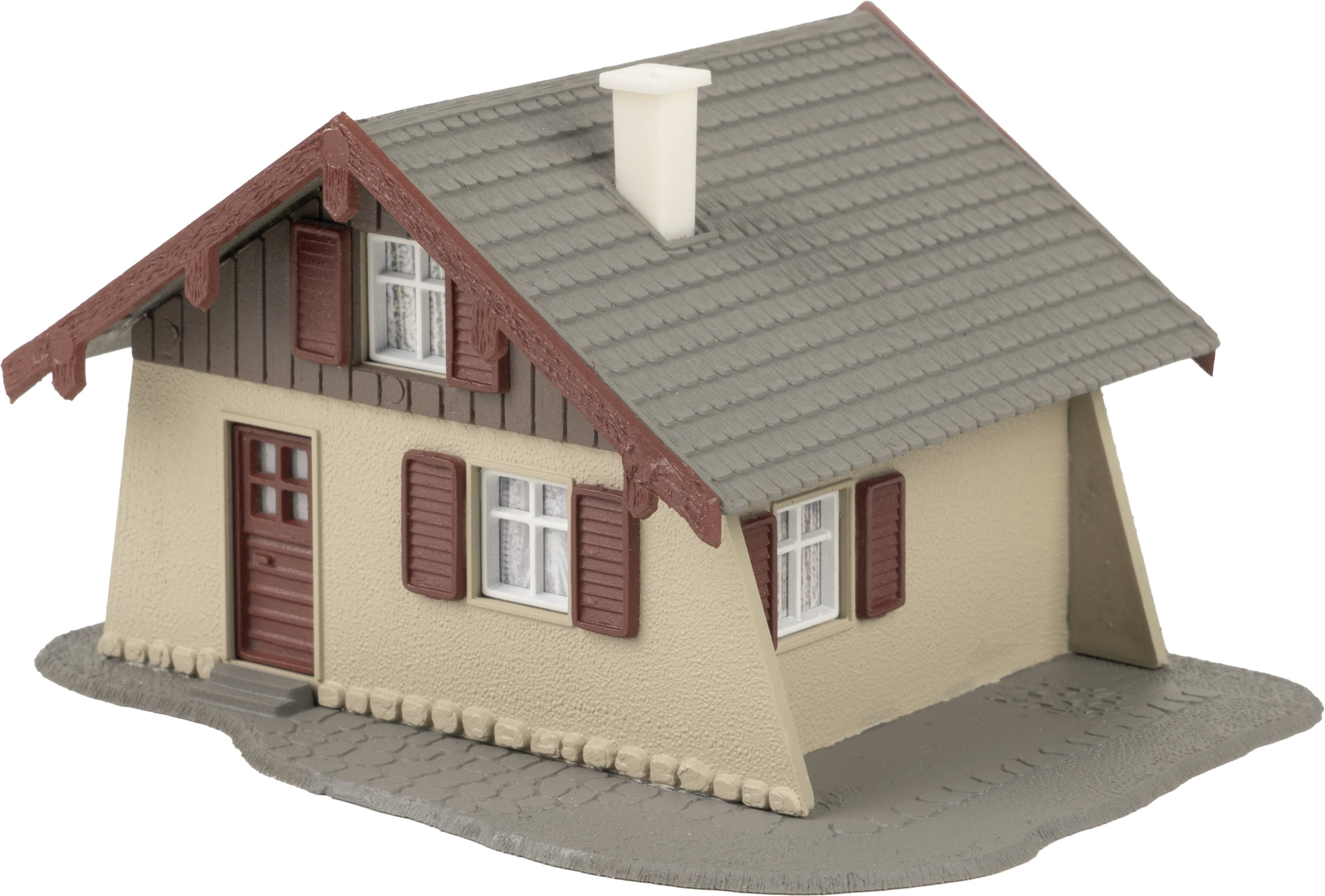 Kleines Modellhaus mit Satteldach, Fenstern mit Fensterläden und Eingangstür. Beige Wände, graues Dach und braune Akzente.
