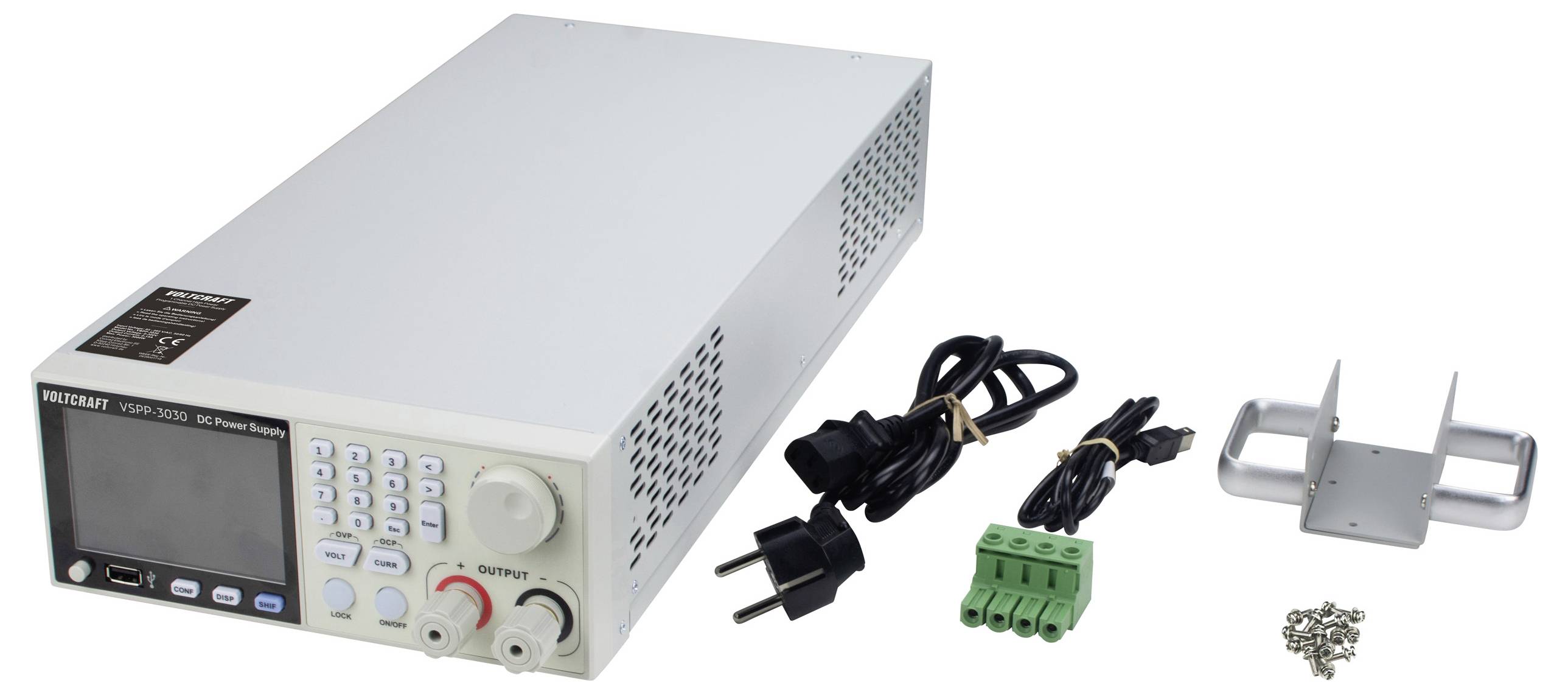 Eine digitale Stromversorgungseinheit mit verschiedenen Anschlüssen, Netzkabeln, grünem Anschlussblock, Montagehalterung und Schrauben, die daneben ausgelegt sind.