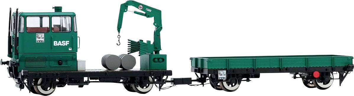 Ein Miniaturmodellzug mit einem grünen Kran und 