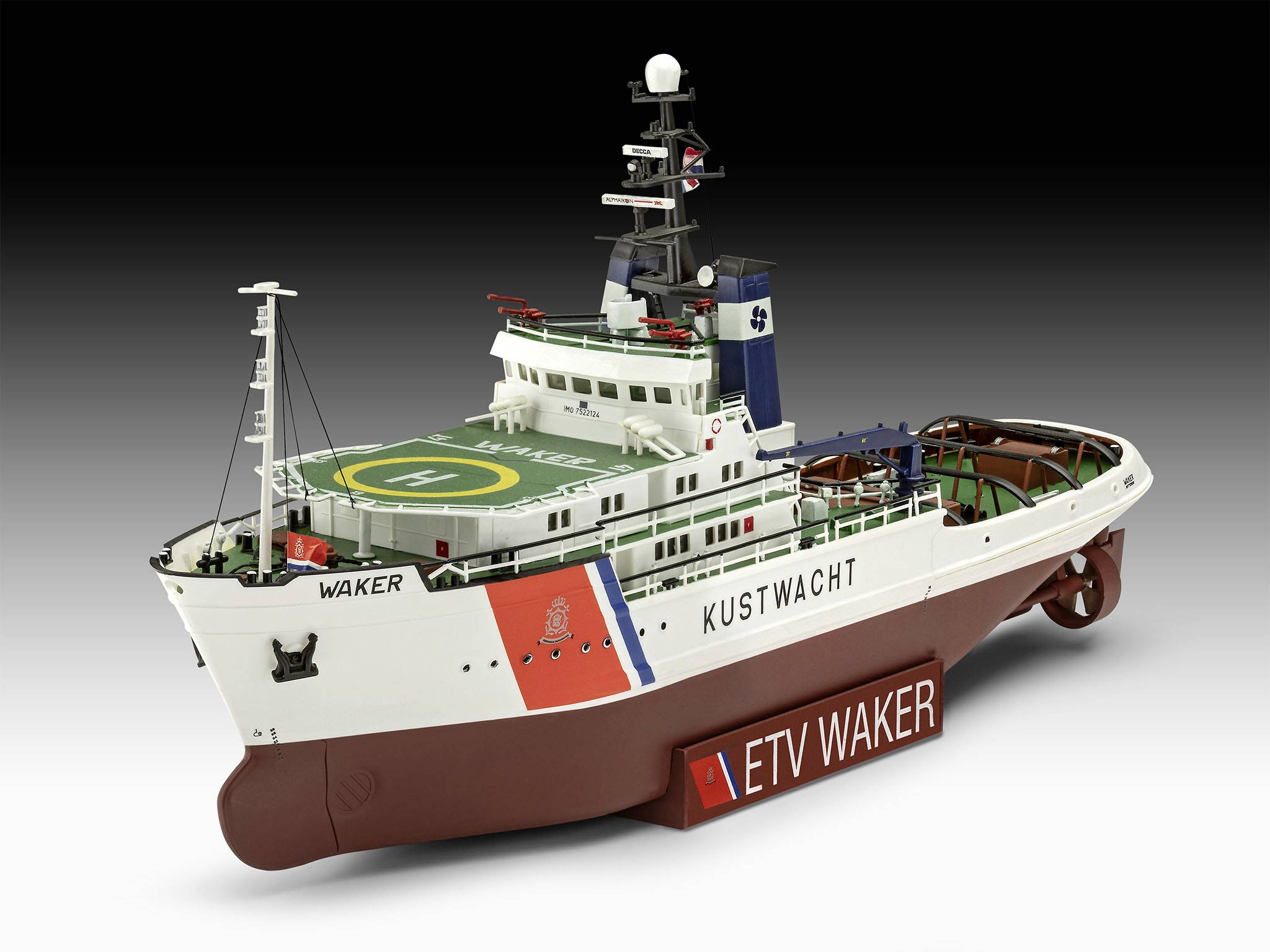 Ein Modellschiff mit der Aufschrift 'KUSTWACHT' und 'ETV WAKER' auf der Seite. Es hat ein Hubschrauberlandeplatz und Funkantennen.