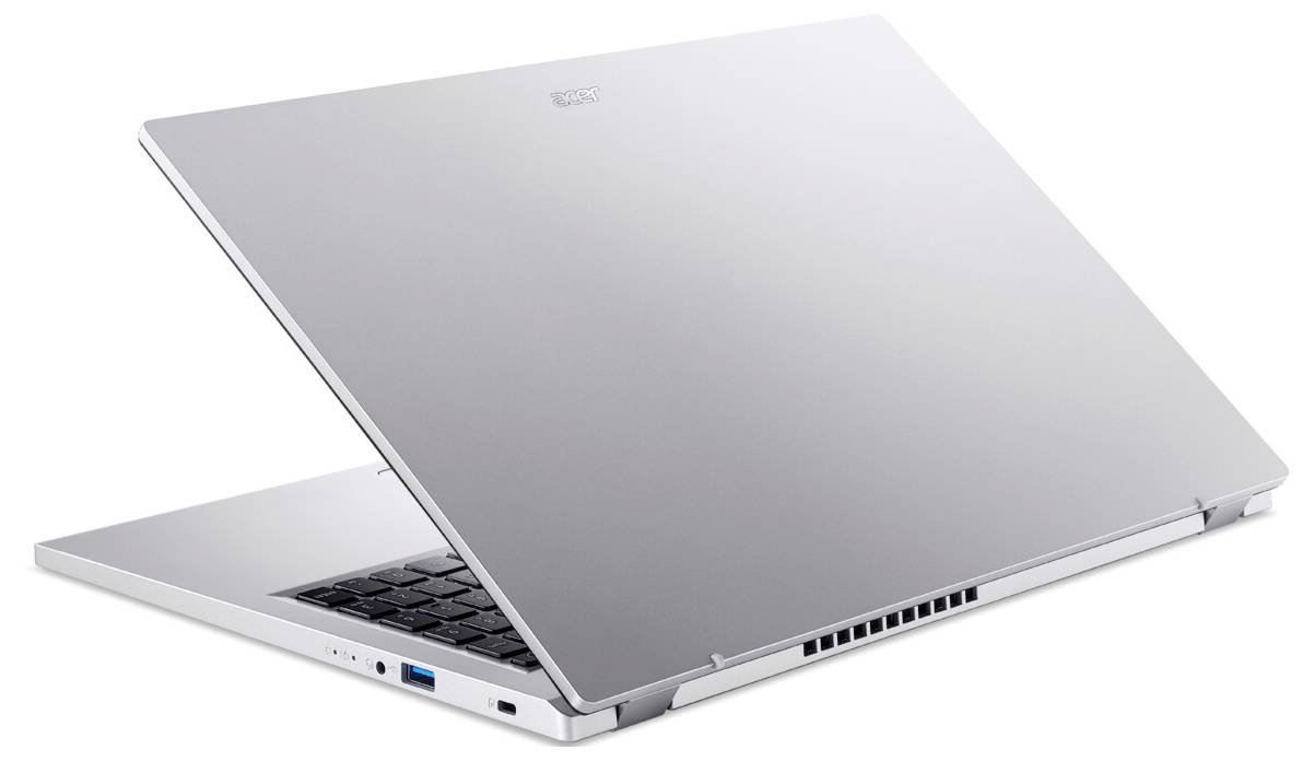 Ein schlanker, silberner Laptop, halb geöffnet, der sein schlankes Design und die schwarze Tastatur zur Schau stellt. Der Fokus liegt auf seiner modernen Ästhetik und den Anschlüssen.