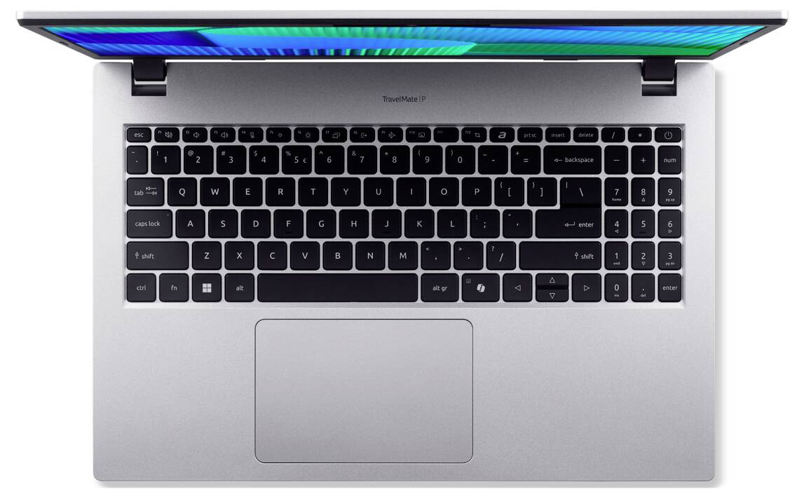 Ein silberner Laptop von oben betrachtet, mit hintergrundbeleuchter Tastatur und Touchpad, dessen farbenfroher Bildschirm Blau- und Grüntöne zeigt.