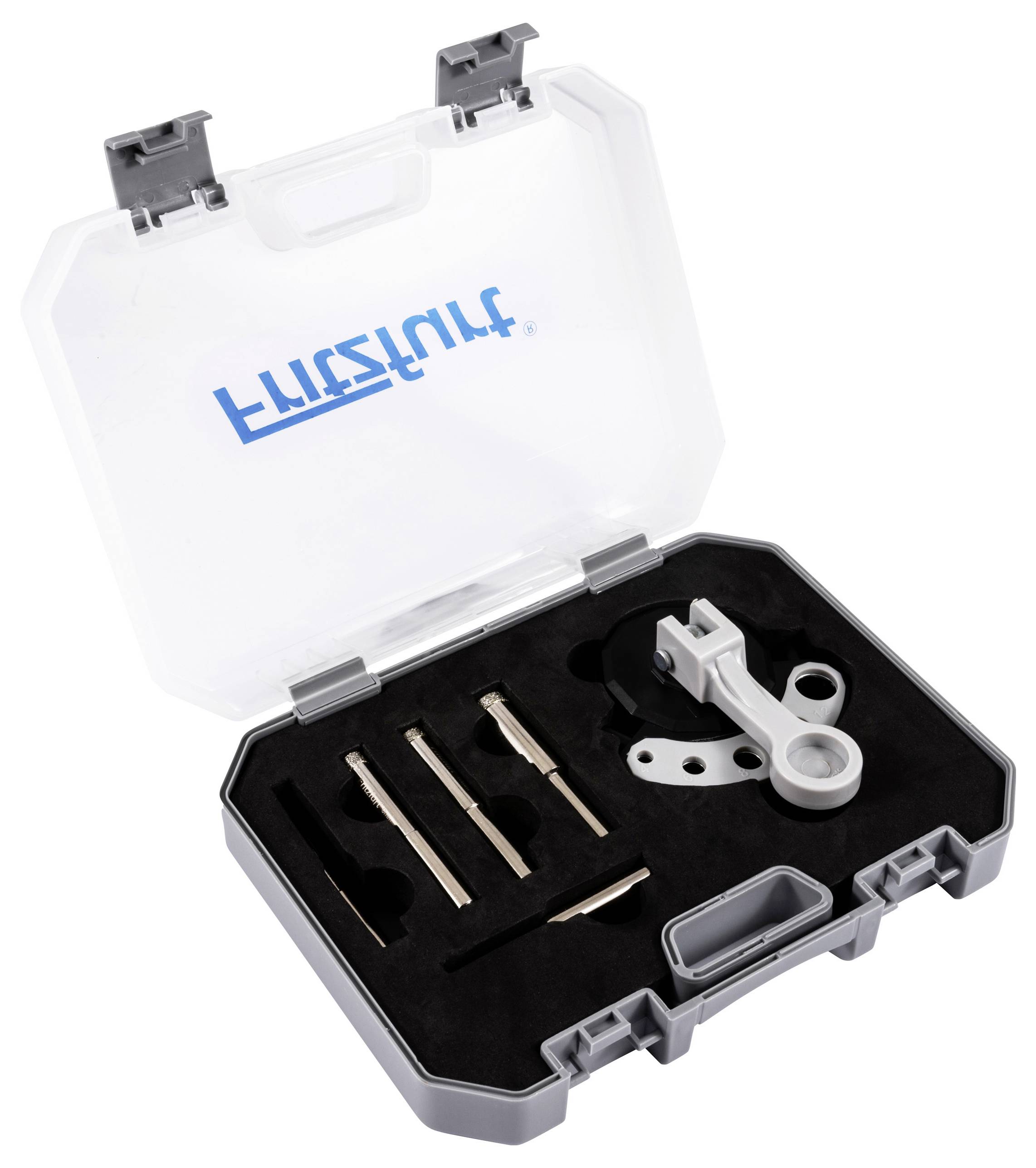 Eine Werkzeugbox mit verschiedenen Präzisionswerkzeugen in einer Schaumstoffeinlage, verwendet für technische oder mechanische Arbeiten, mit transparentem Deckel.